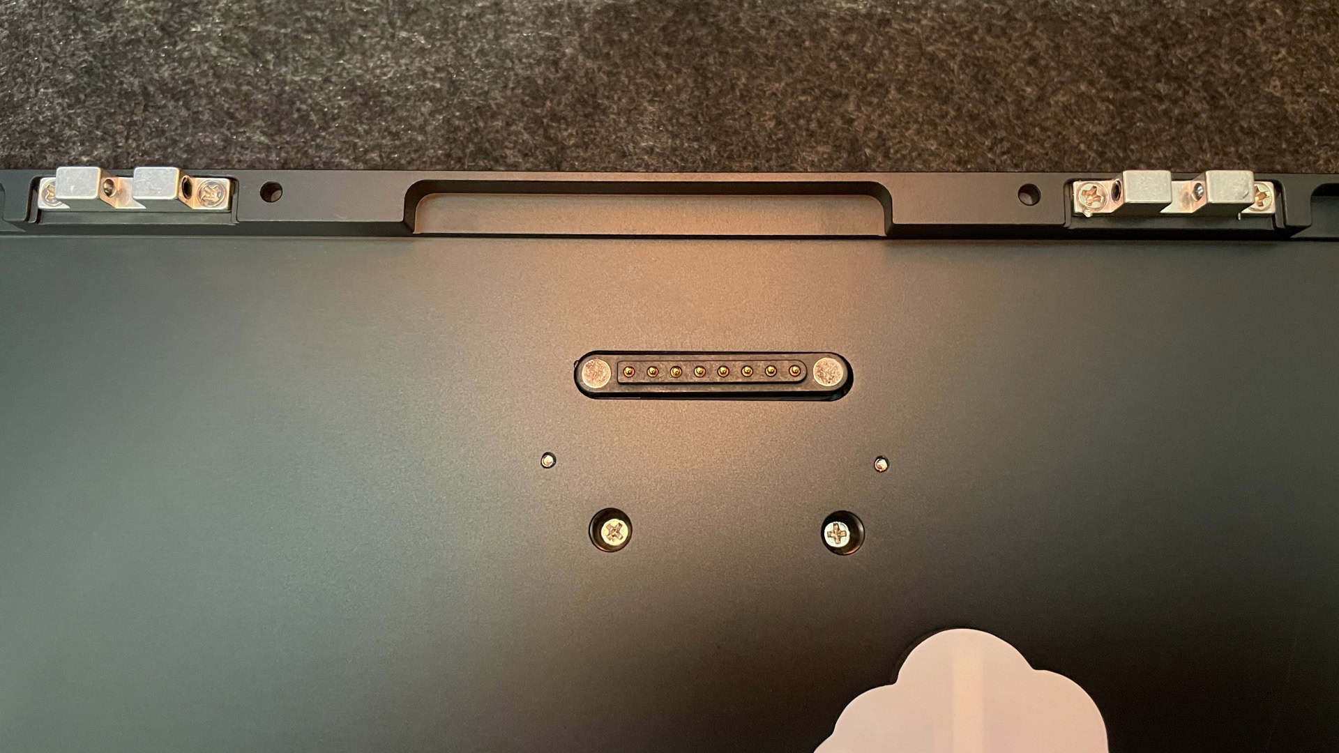 Close-up of the magnetic pogo-pin connector on the Weikav NUT65 mechanical keyboard.