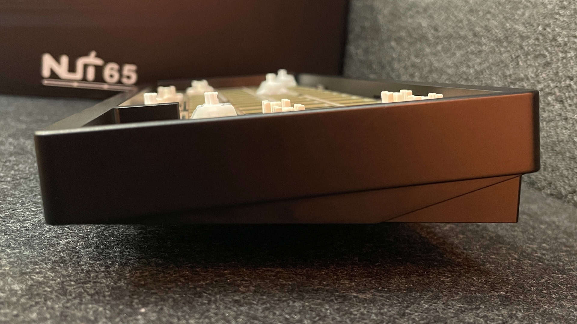 Side view of the mechanical keyboard showing its profile.