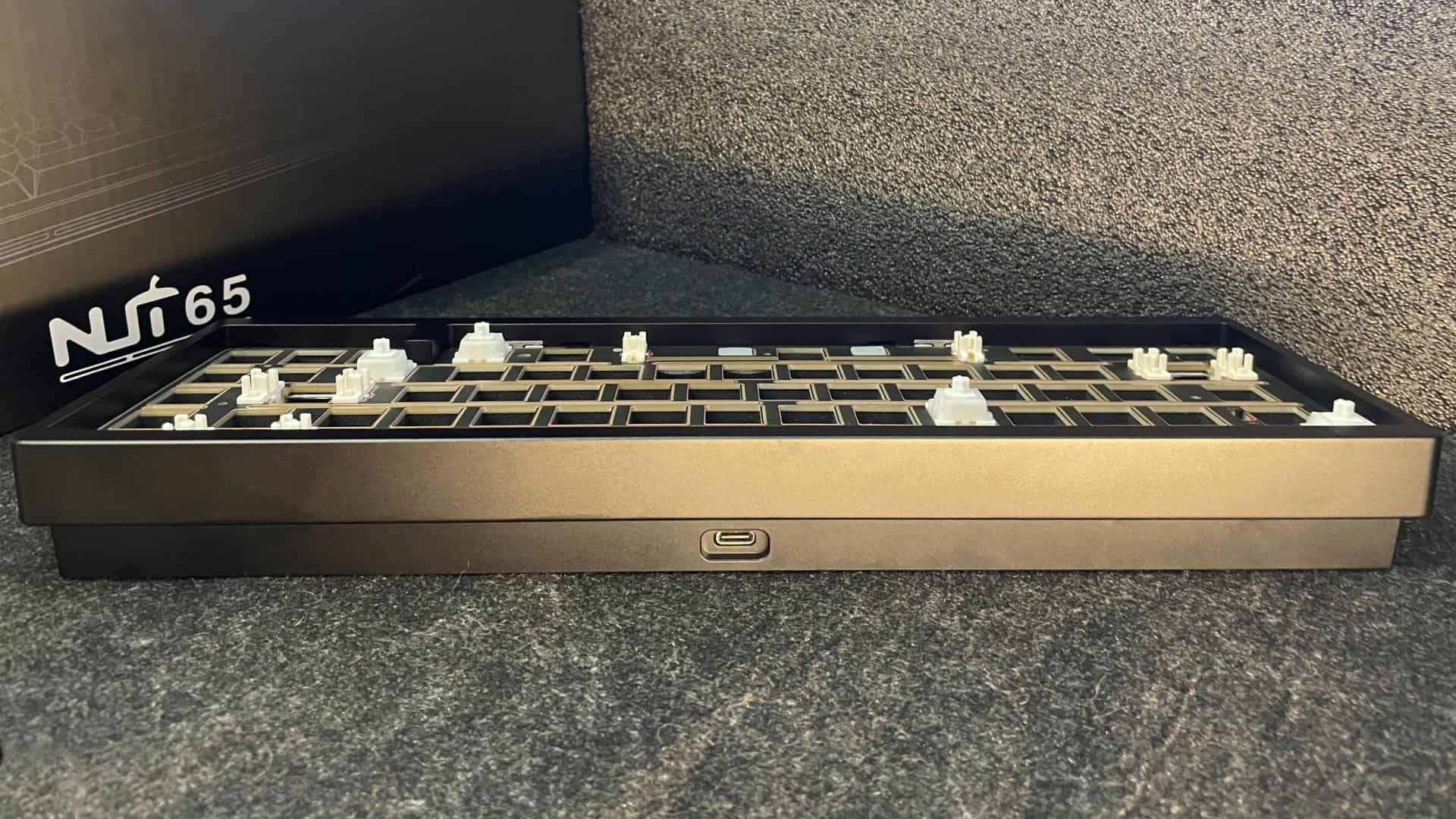Rear side of the Weikav NUT65 mechanical keyboard with the USB port.