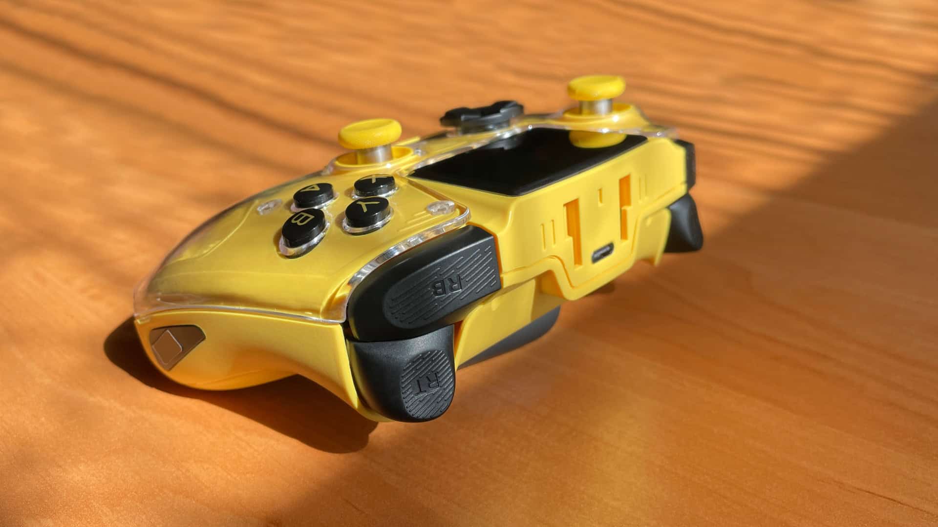 Close-up of the Anbernic RG G01 controller showing its L1/L2 and R1/R2 triggers, shoulder buttons, and the mounting points for attaching a smartphone holder