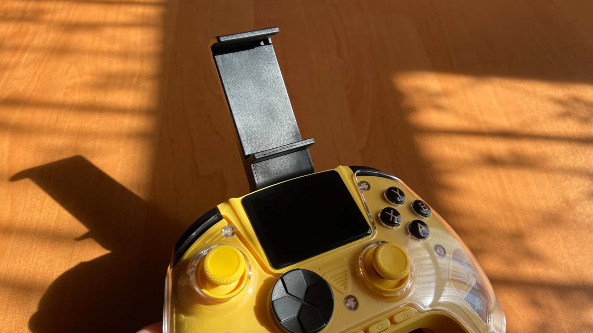 Anbernic RG G01 controller with a smartphone holder attached