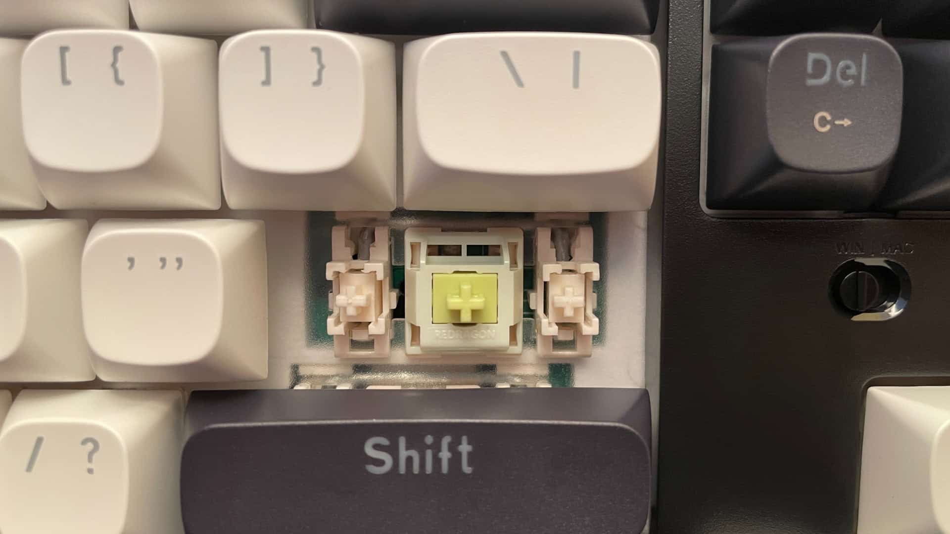 Close-up of the stabilizers on the Redragon Wyvern K761 Pro mechanical keyboard showing that they are pre-lubed.
