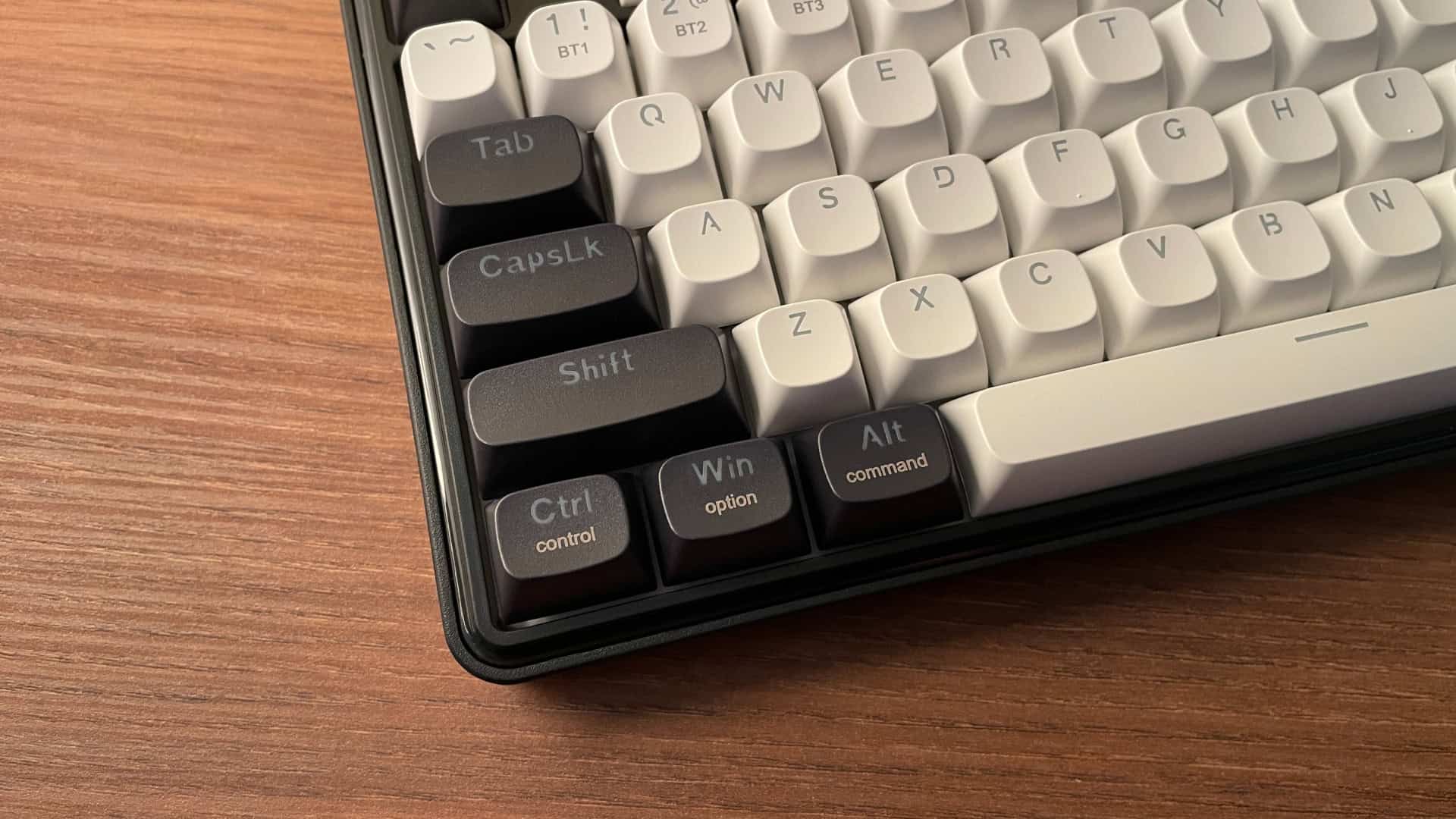 Close-up of keycaps on the Redragon Wyvern K761 Pro mechanical keyboard showing laser-engraved secondary Mac function legends.
