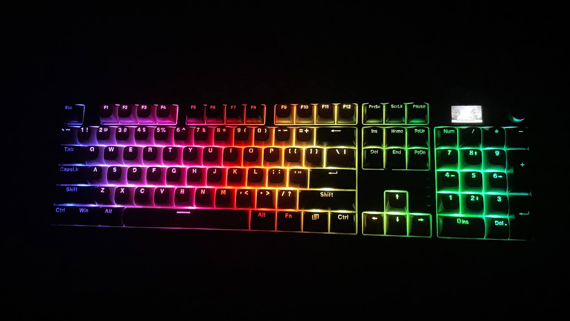 The Redragon Wyvern K761 Pro mechanical keyboard with RGB backlighting turned on, showing the illuminated keys and lighting brightness.
