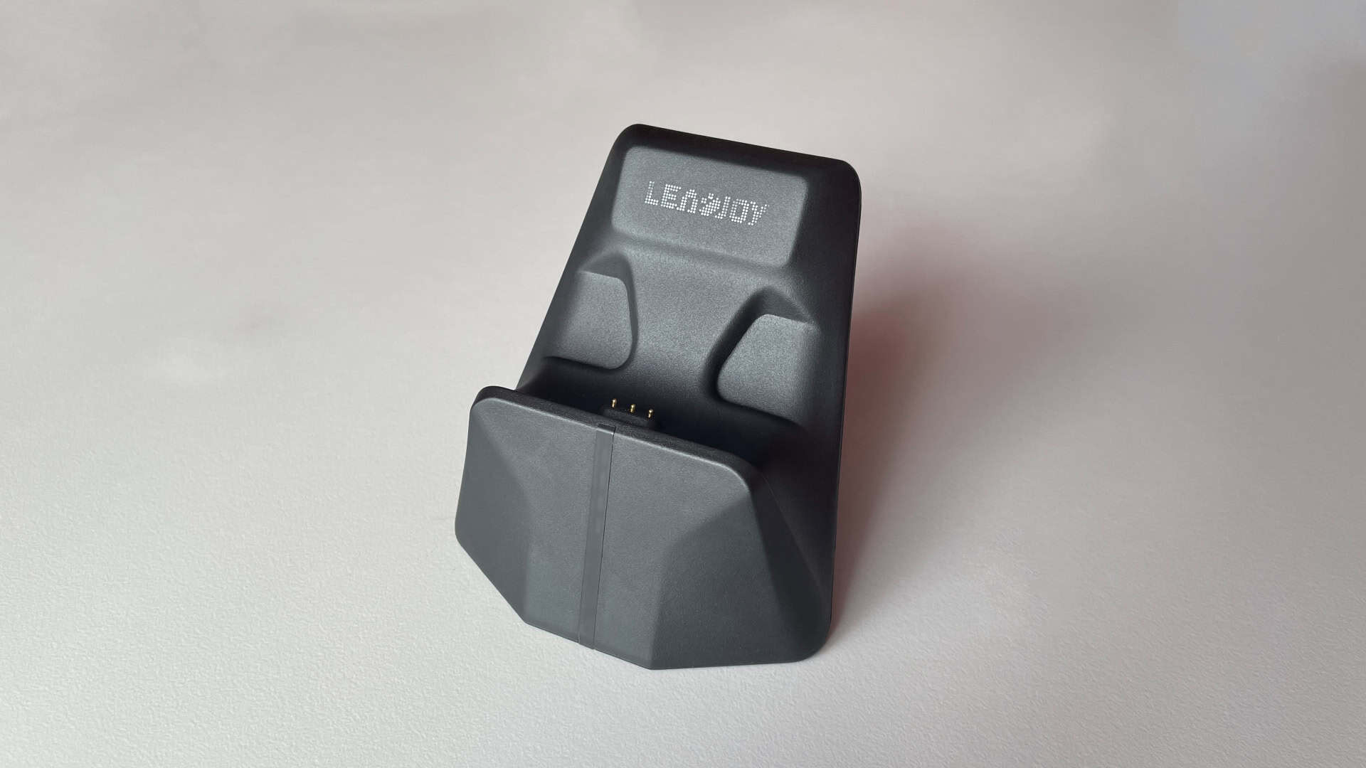 A close-up view of the Leadjoy Xeno Plus charging dock.
