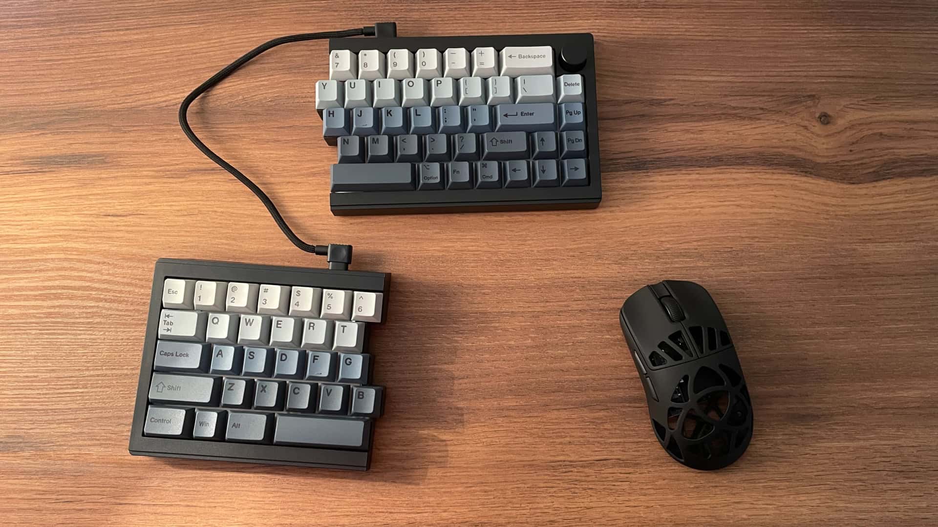 Epomaker Split65 with the left half in use and the right half positioned at the top of the desk.