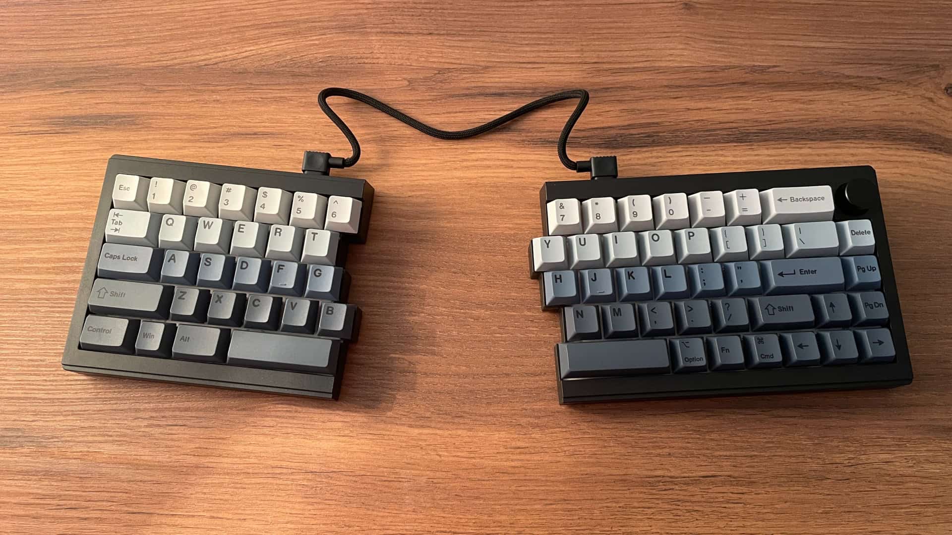 Epomaker Split65 mechanical keyboard with both halves spaced apart on the desk.