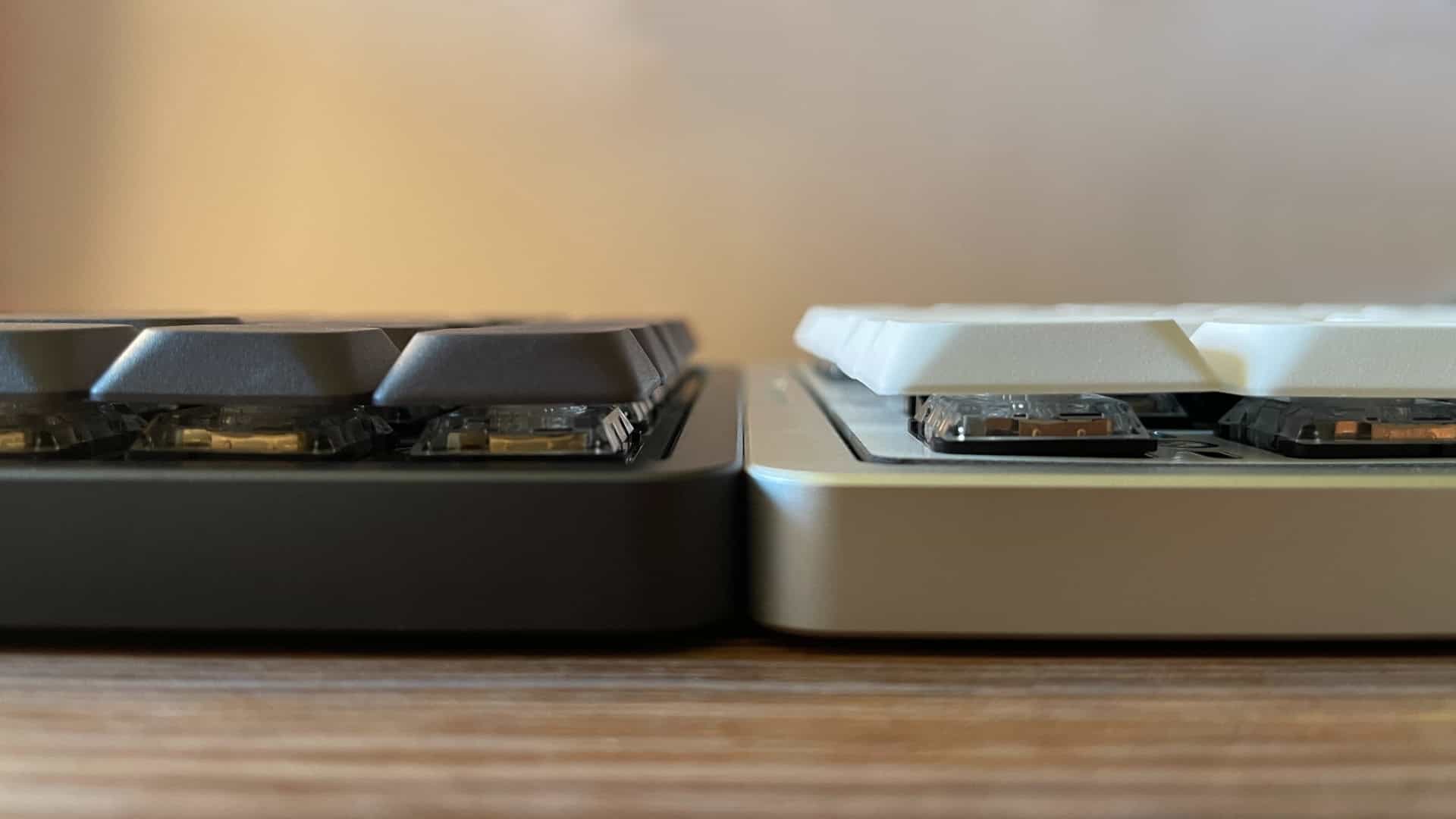 Side-by-side comparison of the IQUNIX Magi75 and MQ80 mechanical keyboards highlighting differences in plate height.