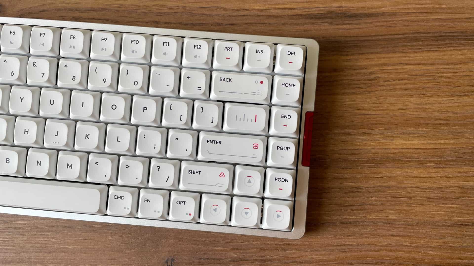 Top-down view of the IQUNIX MQ80 in the Moonlight Silver colorway, featuring paper-white keycaps with red and gray accents, creating a clean futuristic sci-fi aesthetic.