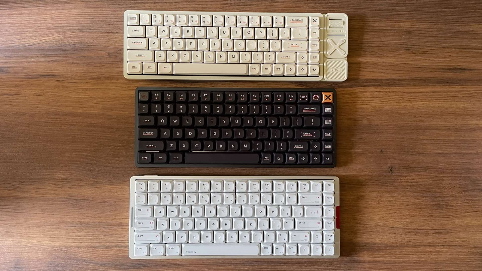 The IQUNIX Magi75, Magi65 Pro, and MQ80 keyboards placed together to highlight their different sizes and design approaches.