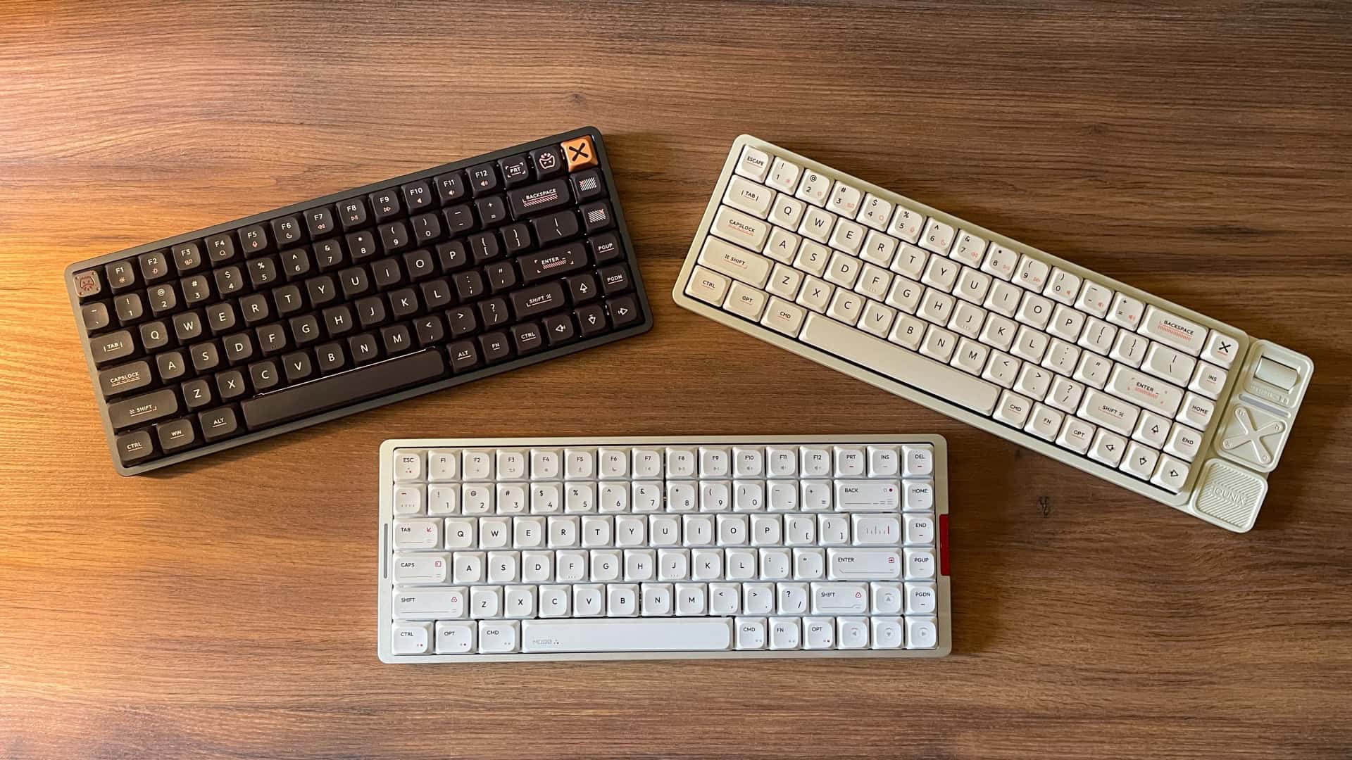 A photo showing the three available color options of IQUNIX low-profile keyboards.