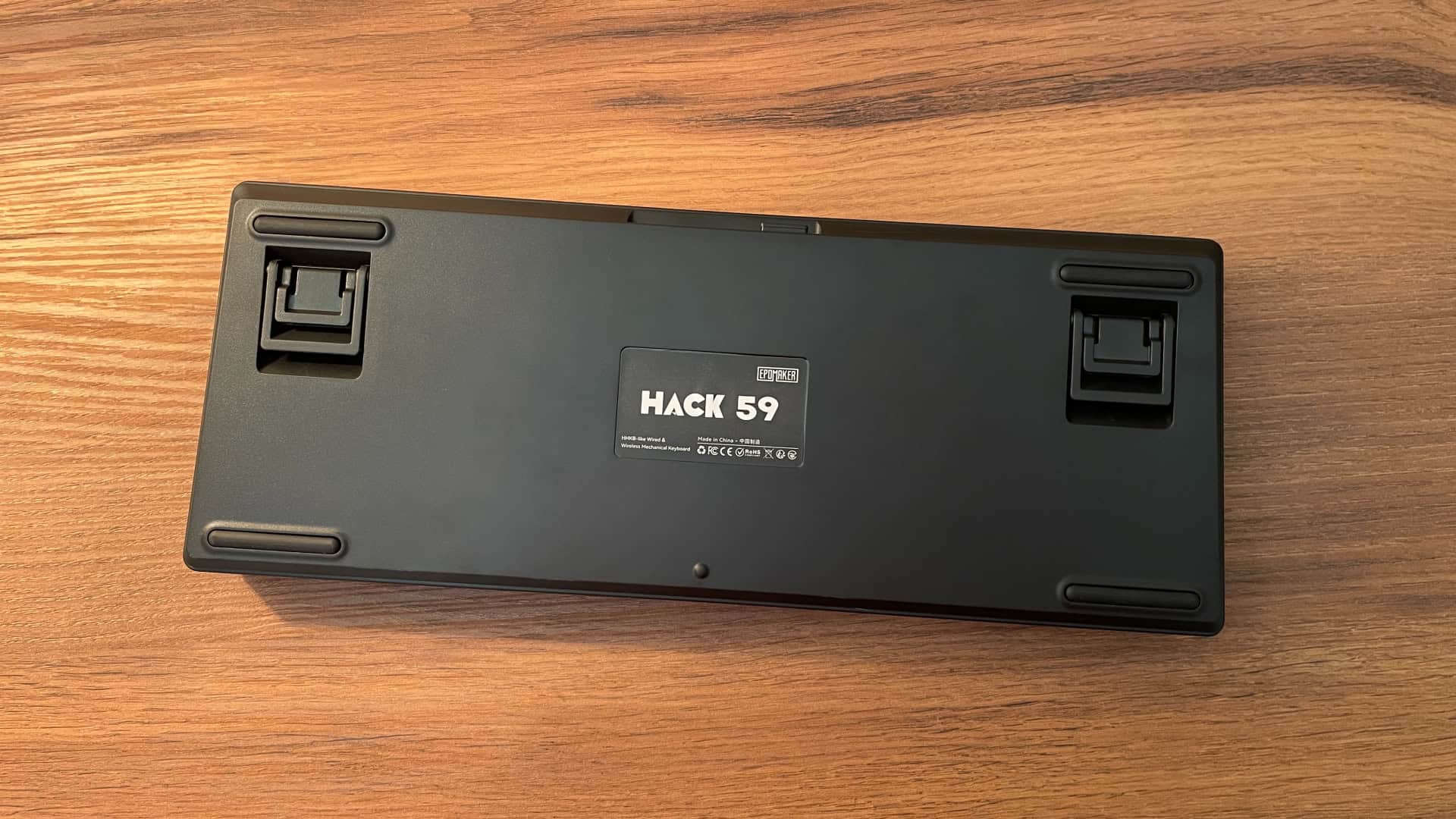 Underside of the Epomaker Hack59 mechanical keyboard, showing the bottom panel design, feet, and structural details.
