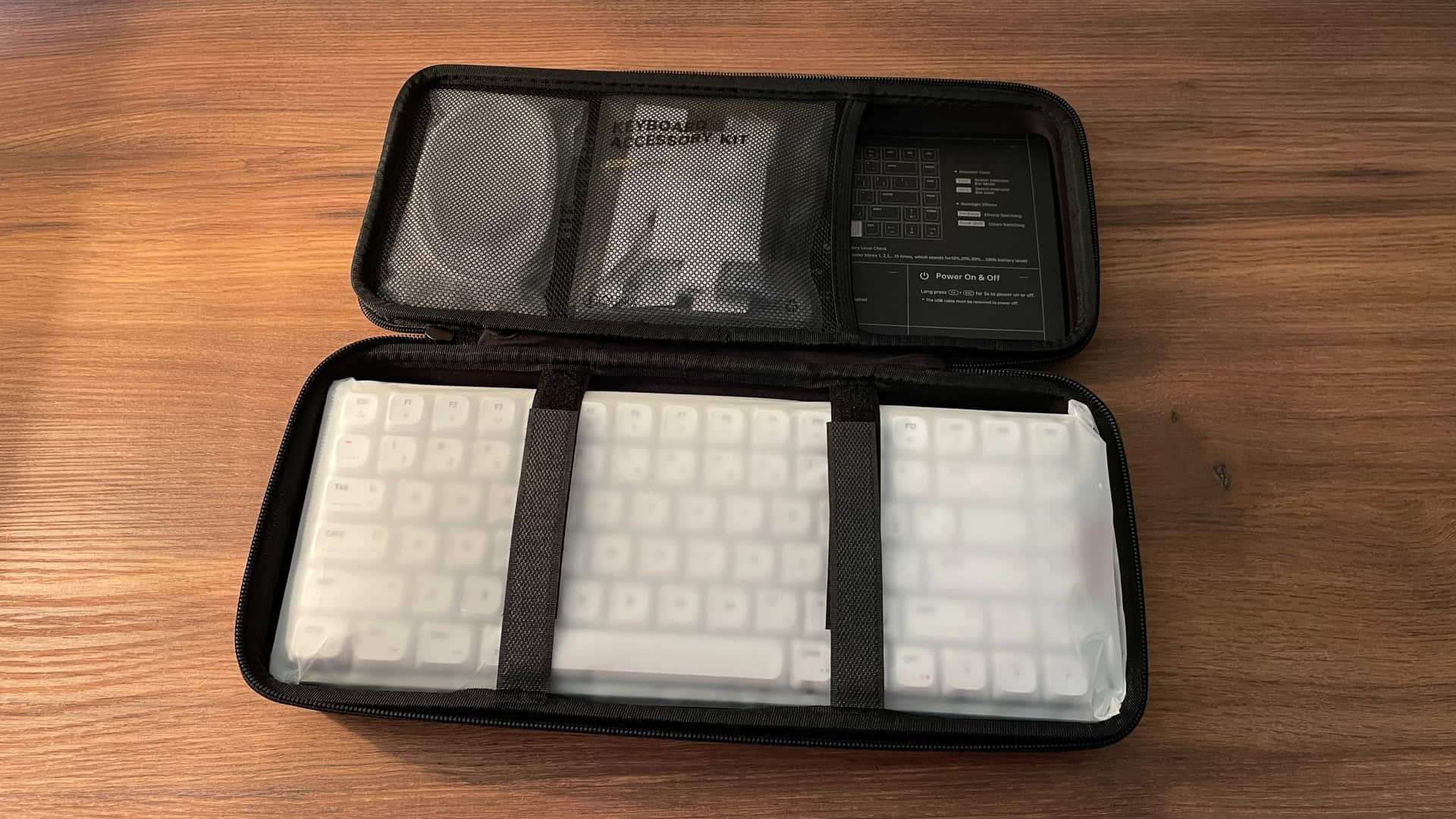 Open hardshell carrying case for the IQUNIX MQ80 mechanical keyboard, showing the interior compartment designed to securely hold and protect the keyboard during transport and storage.