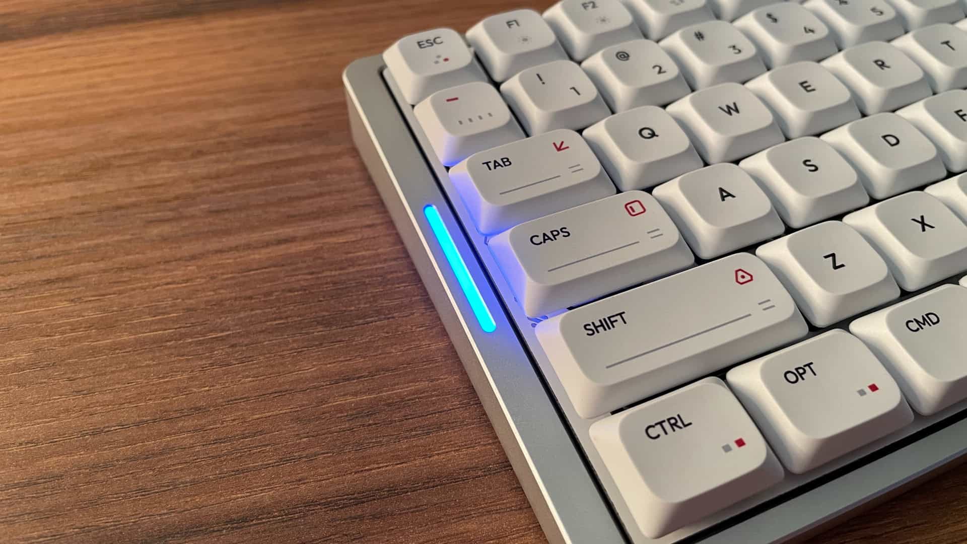 Close-up of the LED indicator on the IQUNIX MQ80 mechanical keyboard, showing the status light detail.