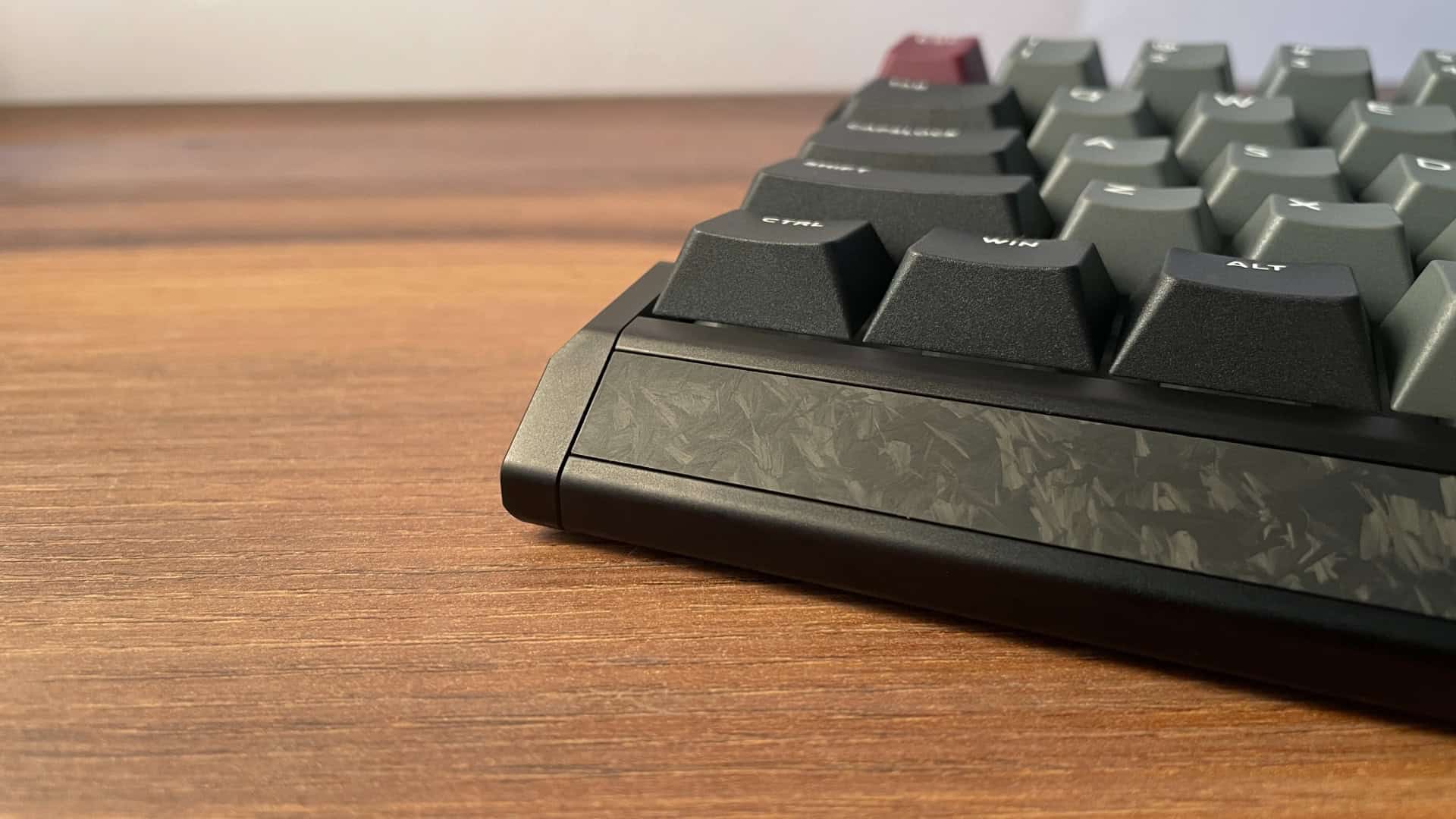 Close-up view of the IQUNIX EV63 mechanical keyboard case highlighting precise machining, tight assembly, and clean edges that demonstrate high build quality.