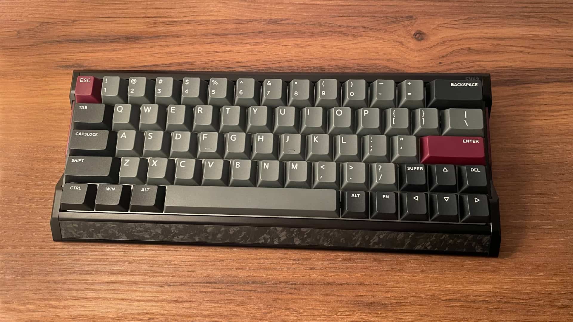 IQUNIX EV63 mechanical keyboard shown from an angle highlighting its overall design, layout, and keycap styling.