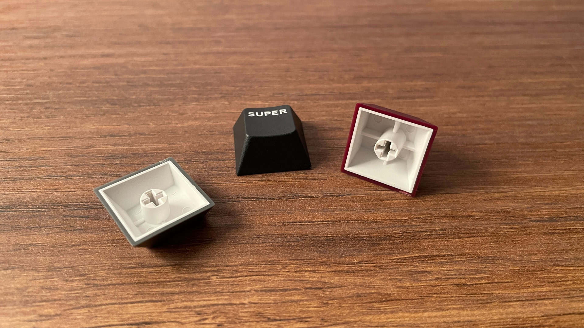Close-up view of IQUNIX EV63 mechanical keyboard keycaps showing surface texture, legends, and finish details.