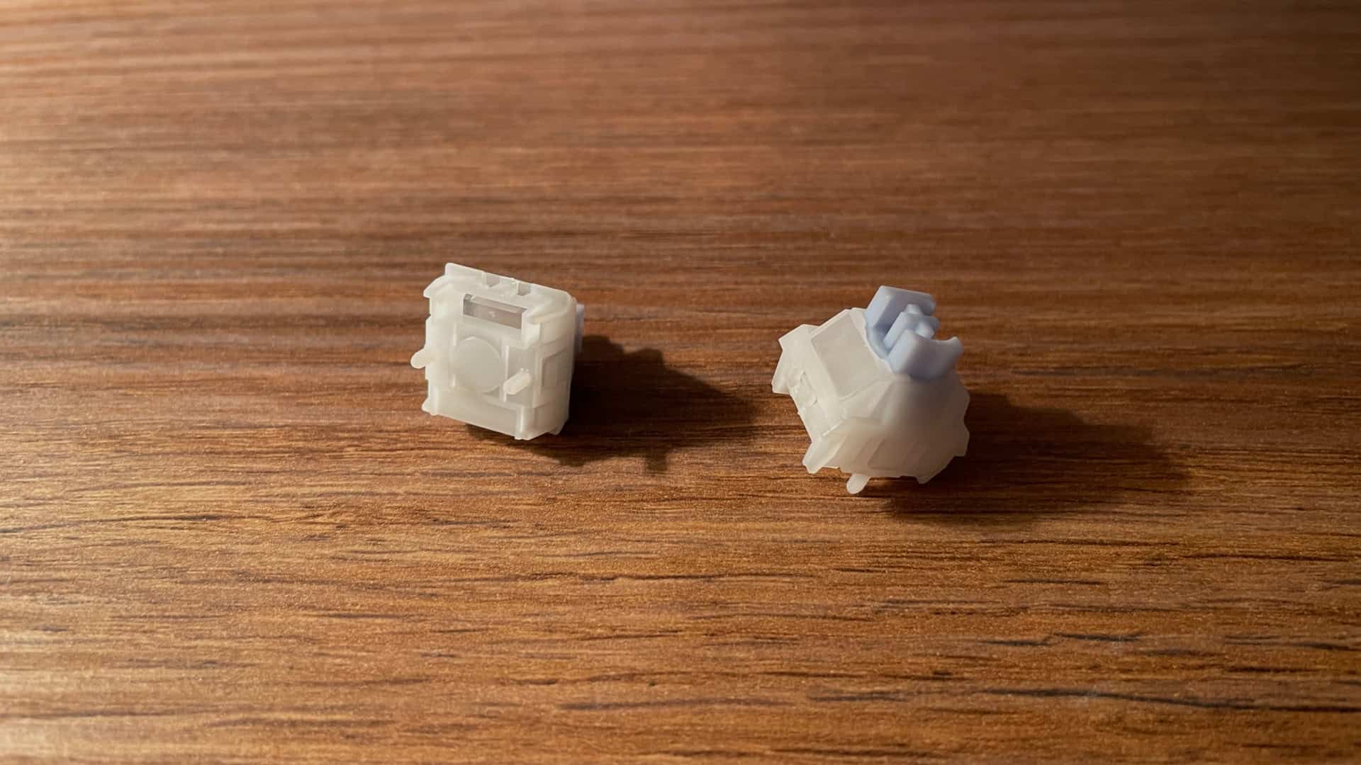 Close-up view of Magnetic X Ultra mechanical switches used in the IQUNIX EV63 keyboard, showing their magnetic structure and switch housing details.
