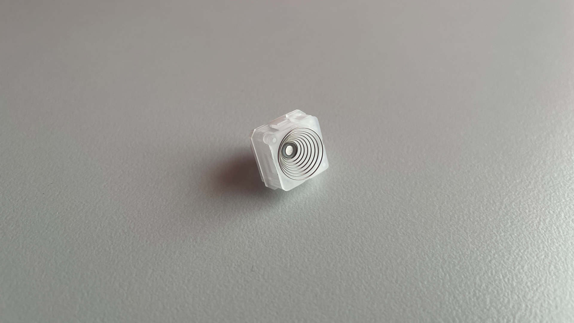 Close-up of an XVX Whisper EC/HE 2-in-1 magnetic silent switch showing the opened bottom housing and internal structure.