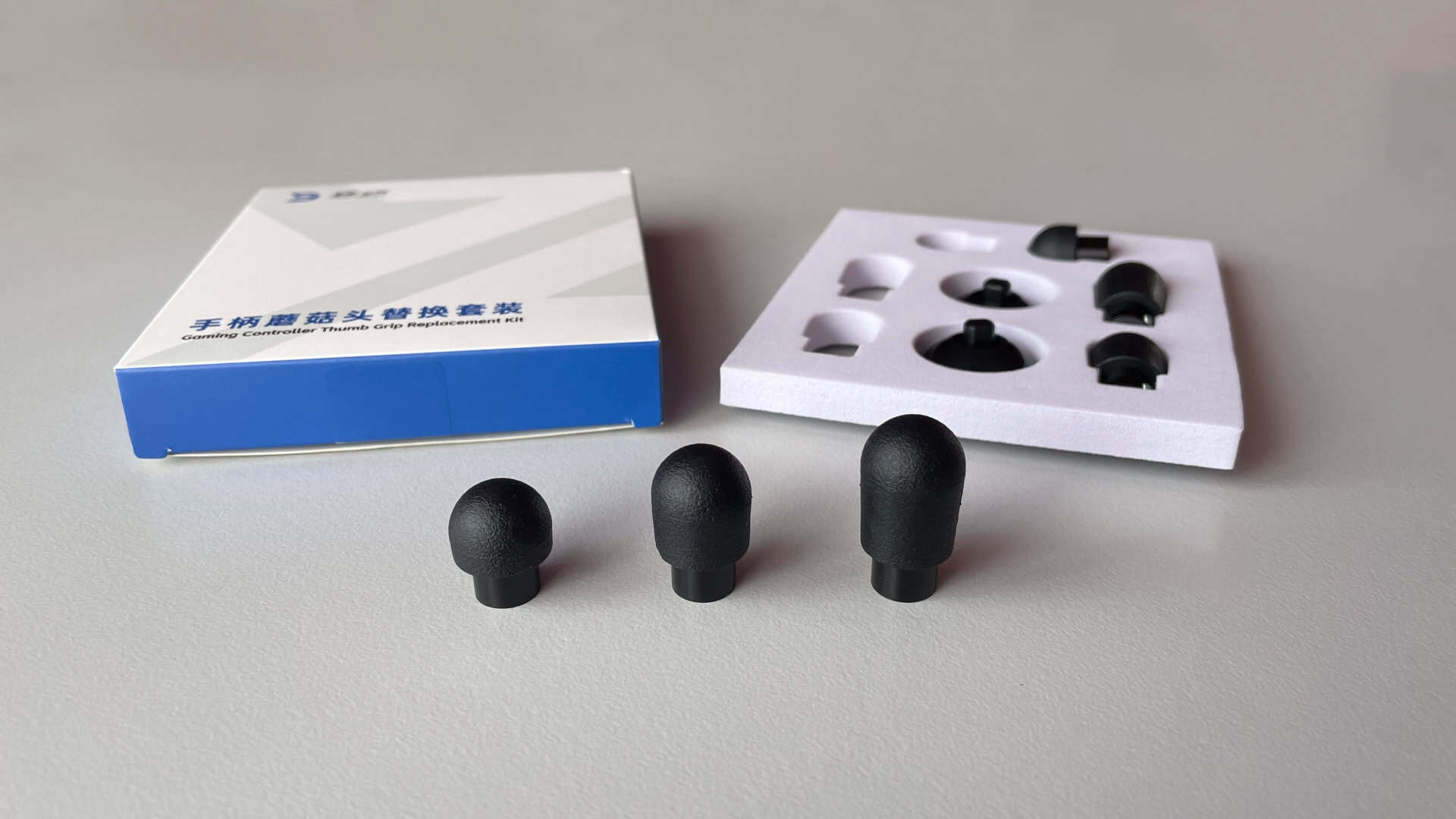 Close-up of the ZD “Arcade-style” interchangeable thumbsticks with detailed finish and design.