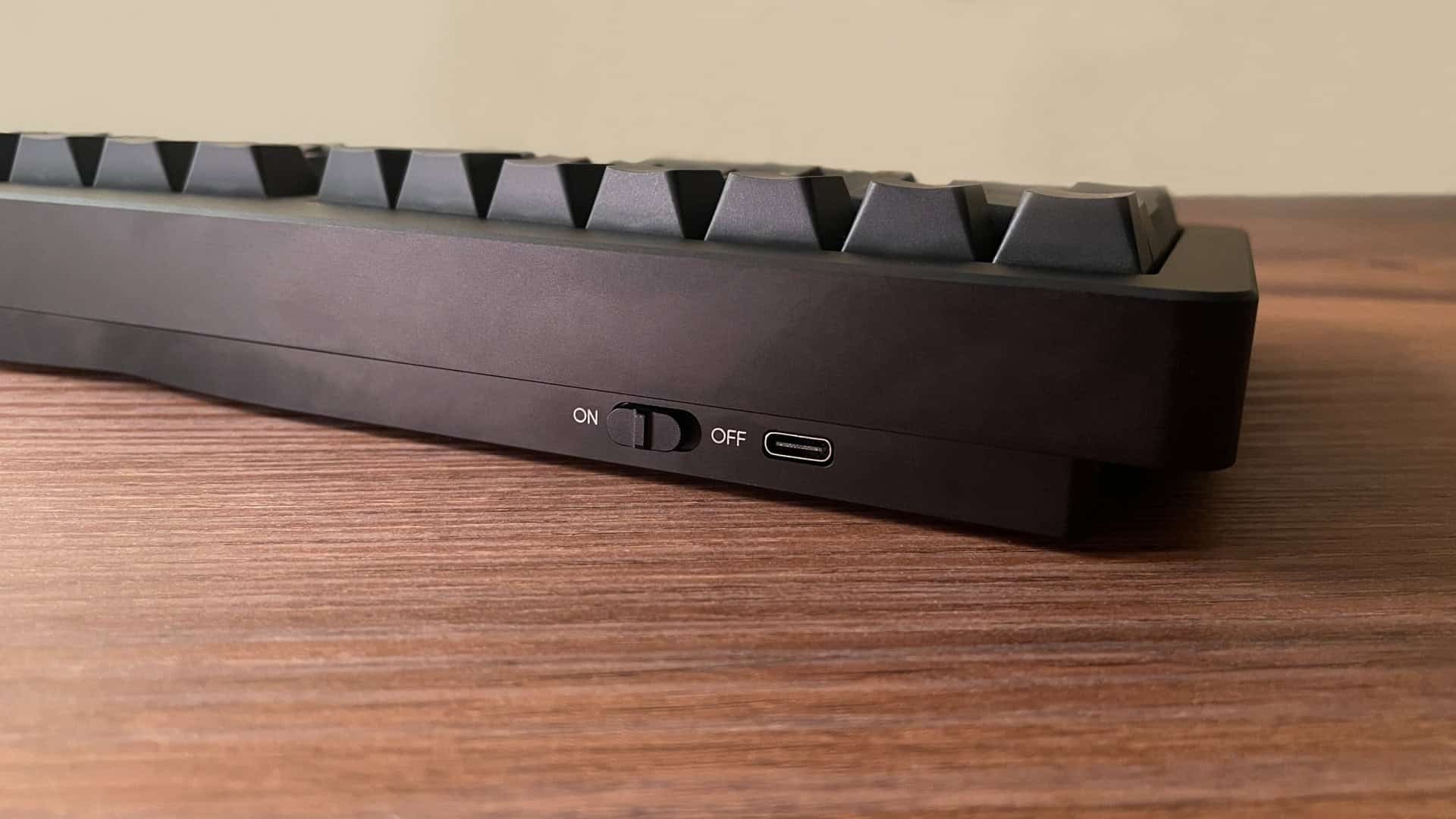 Rear view of the Epomaker Tide Alice mechanical keyboard showing the USB port and the on/off power switch.