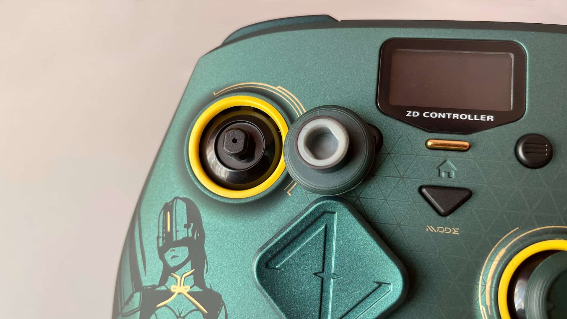 Close-up of the ZD Classic Legend Ling Cage Limited Edition controller's removable thumbstick mechanism, showing how the thumbstick slides onto the base without using fragile plastic clips.
