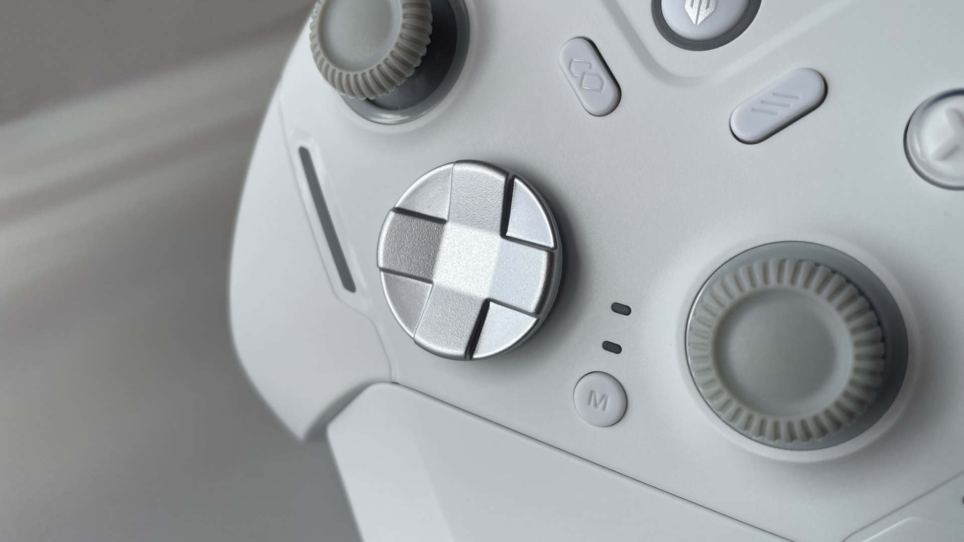 Close-up of the Fantech Zenith Pro controller D-pad featuring a hybrid disc-shaped design for directional input control.
