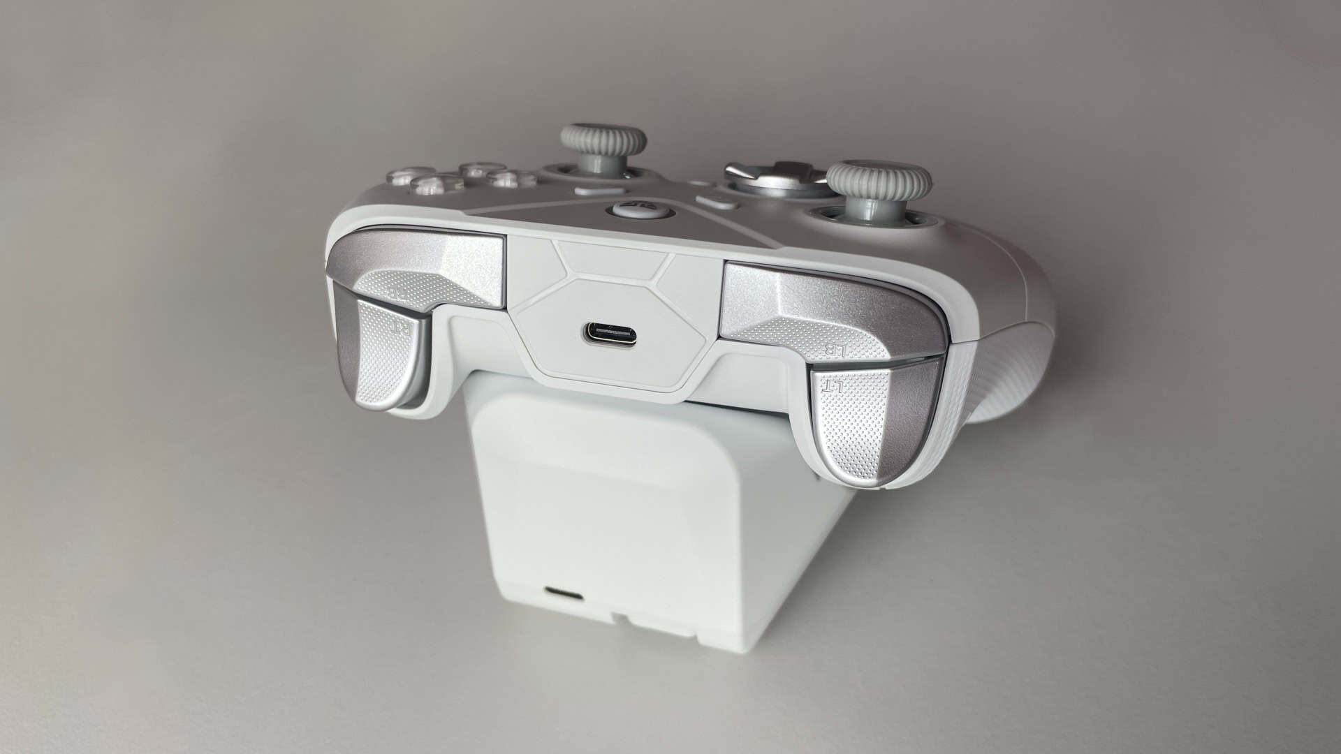 Close-up of the Fantech Zenith Pro controller top section showing the triggers and bumpers with their surface texture and button layout.