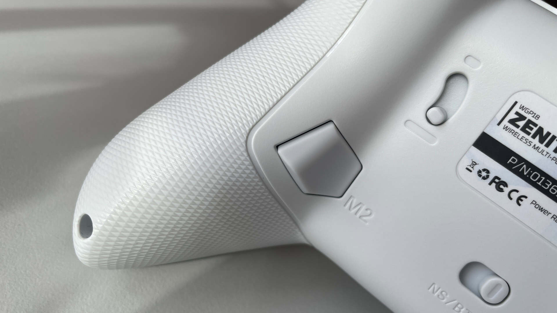 Close-up of the Fantech Zenith Pro controller grips showing the laser-etched textured surface designed for balanced, non-slip handling.