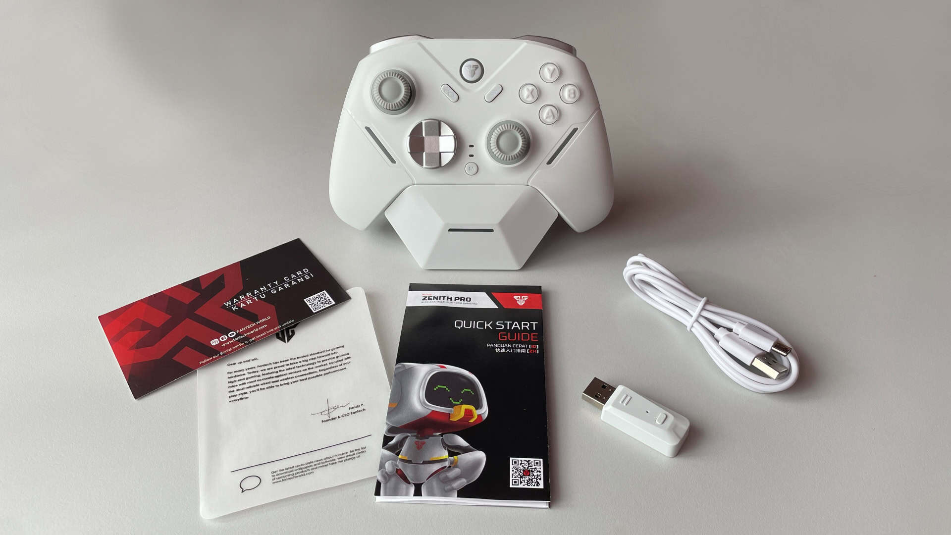 Box contents of the Fantech Zenith Pro controller, showing the included accessories and packaging components laid out.
