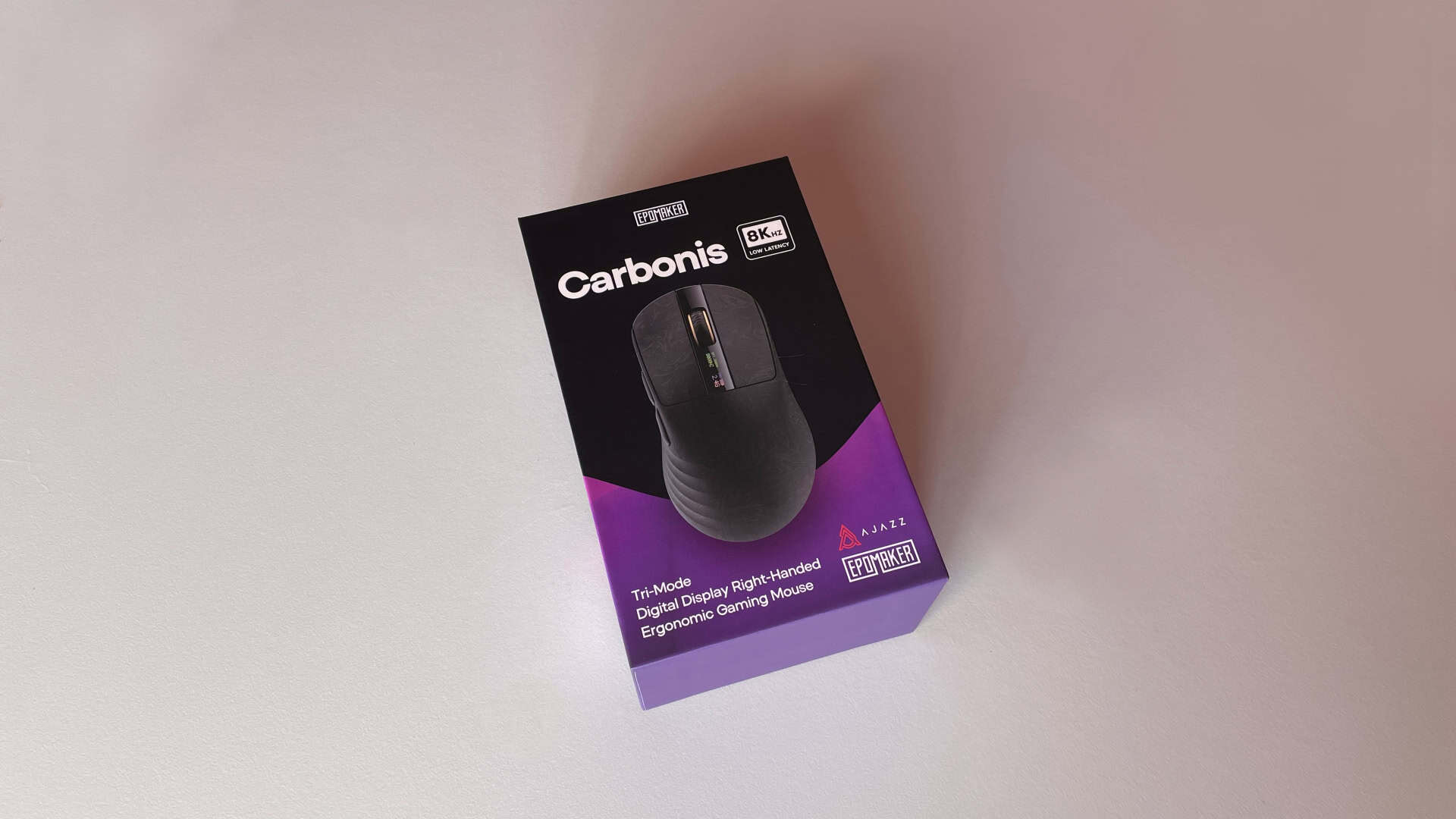 The retail packaging of the Epomaker Carbonis wireless gaming mouse displayed from the front.