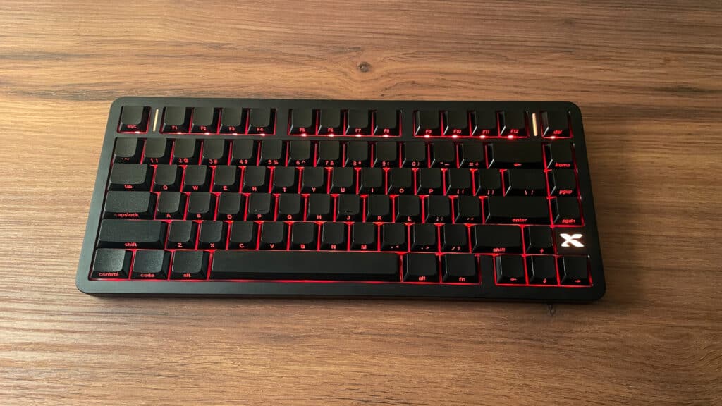 XVX L75 Air low-profile mechanical keyboard with RGB backlighting visible in a bright environment, showing the lighting effects under normal room conditions.