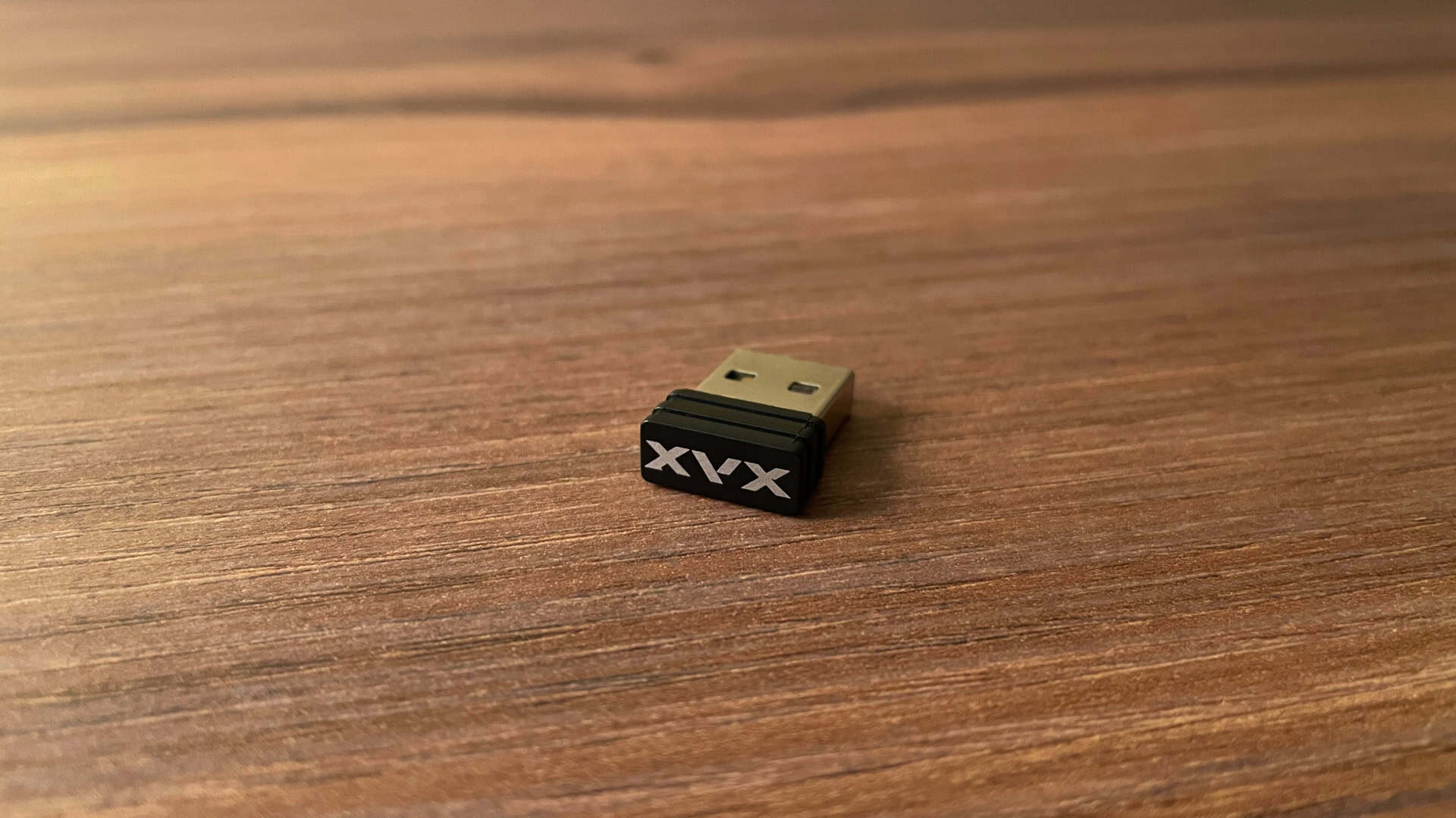 Close-up view of the XVX L75 Air 2.4GHz wireless receiver dongle included for low-latency wireless keyboard connectivity.