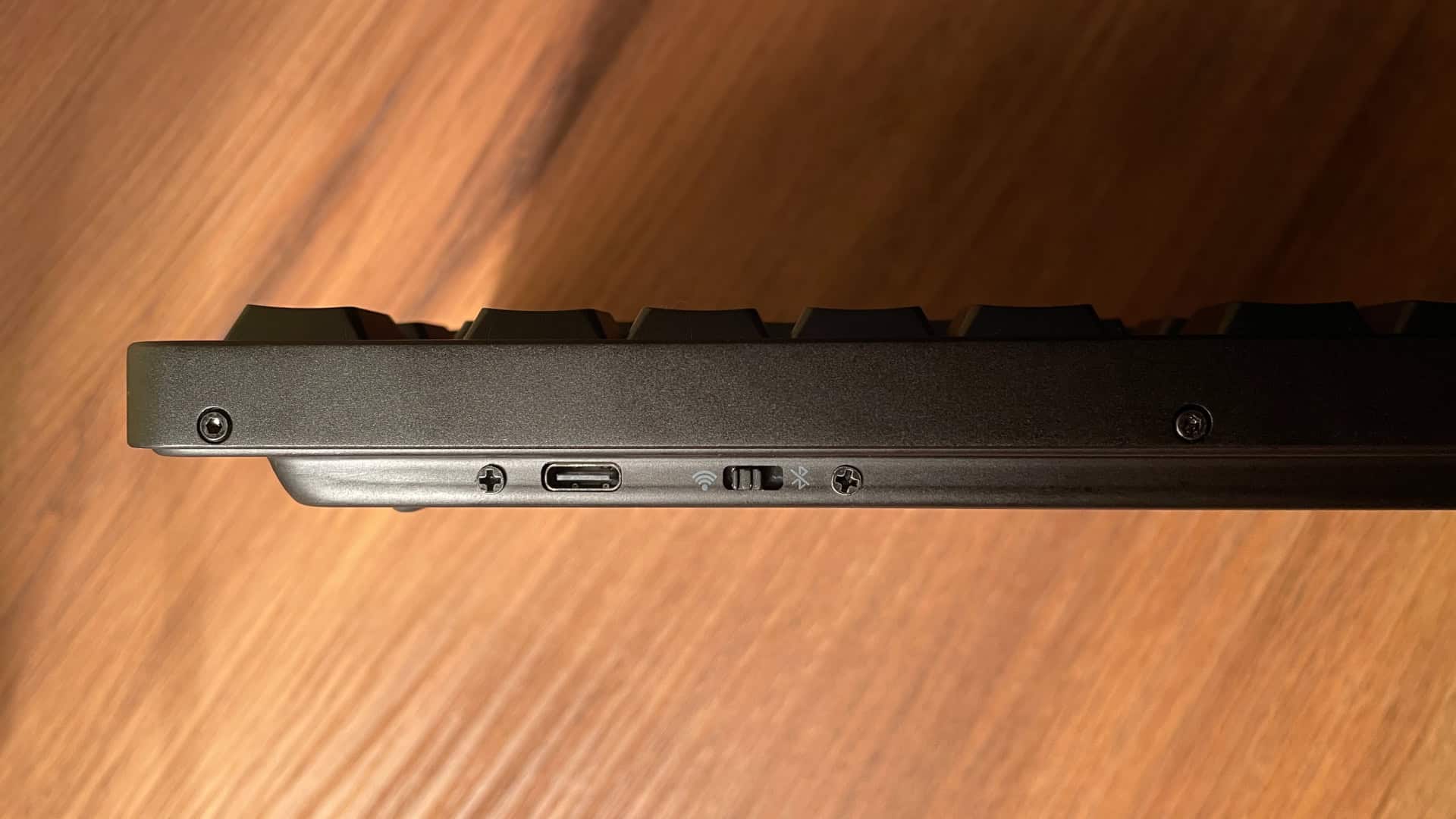 Close-up view of the XVX L75 Air rear side showing the USB-C port and wireless connectivity switch.