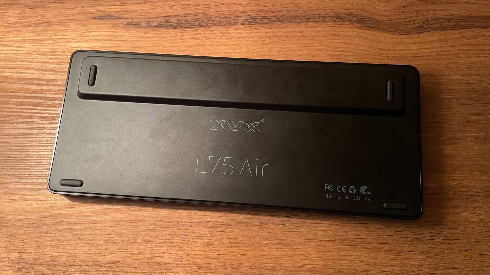 Bottom view of the XVX L75 Air low-profile mechanical keyboard, showing the underside design, structural details, and rubber feet for stability.