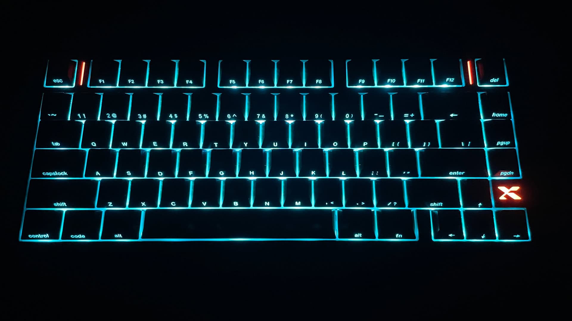 XVX L75 Air keycaps illuminated in a dark environment, showing the clear shine-through legends and RGB backlighting visibility.