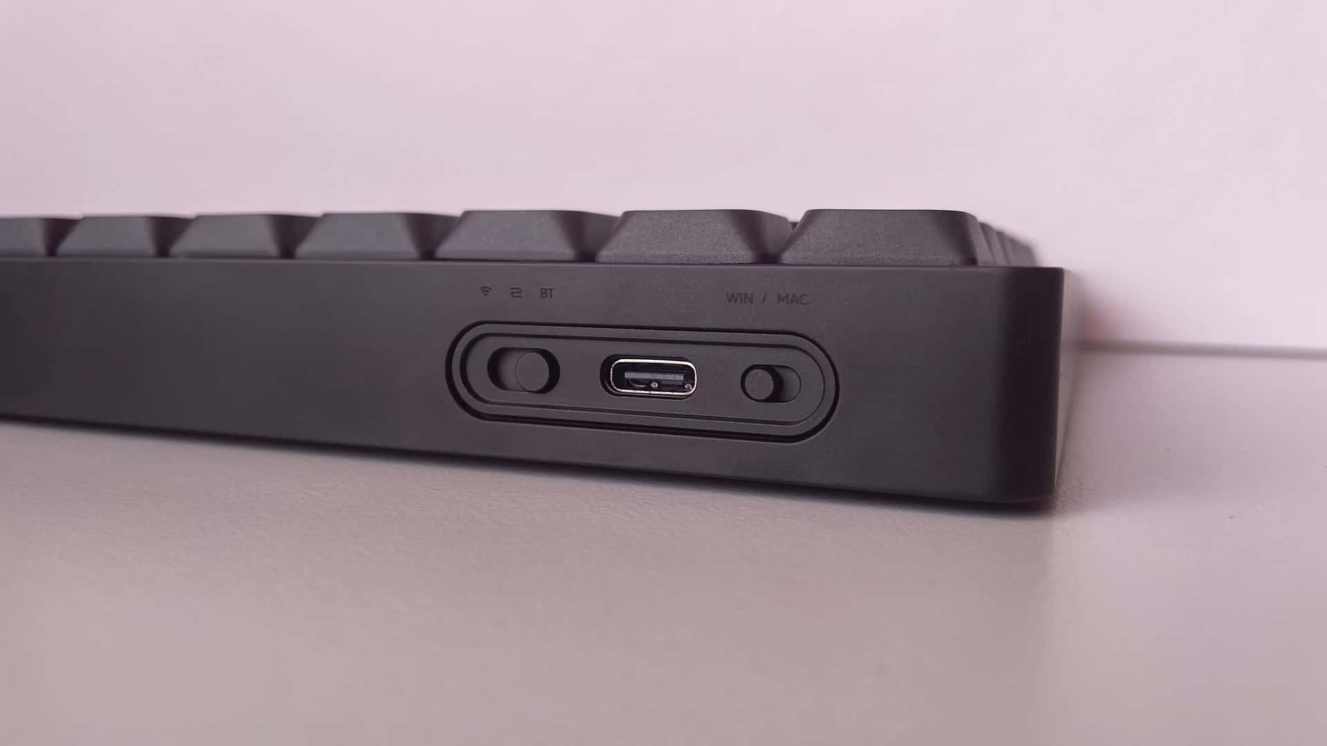 Rear view of the ATK Yogo 75 Pro showing the USB-C port, connection mode switch, and Windows/Mac compatibility switch.