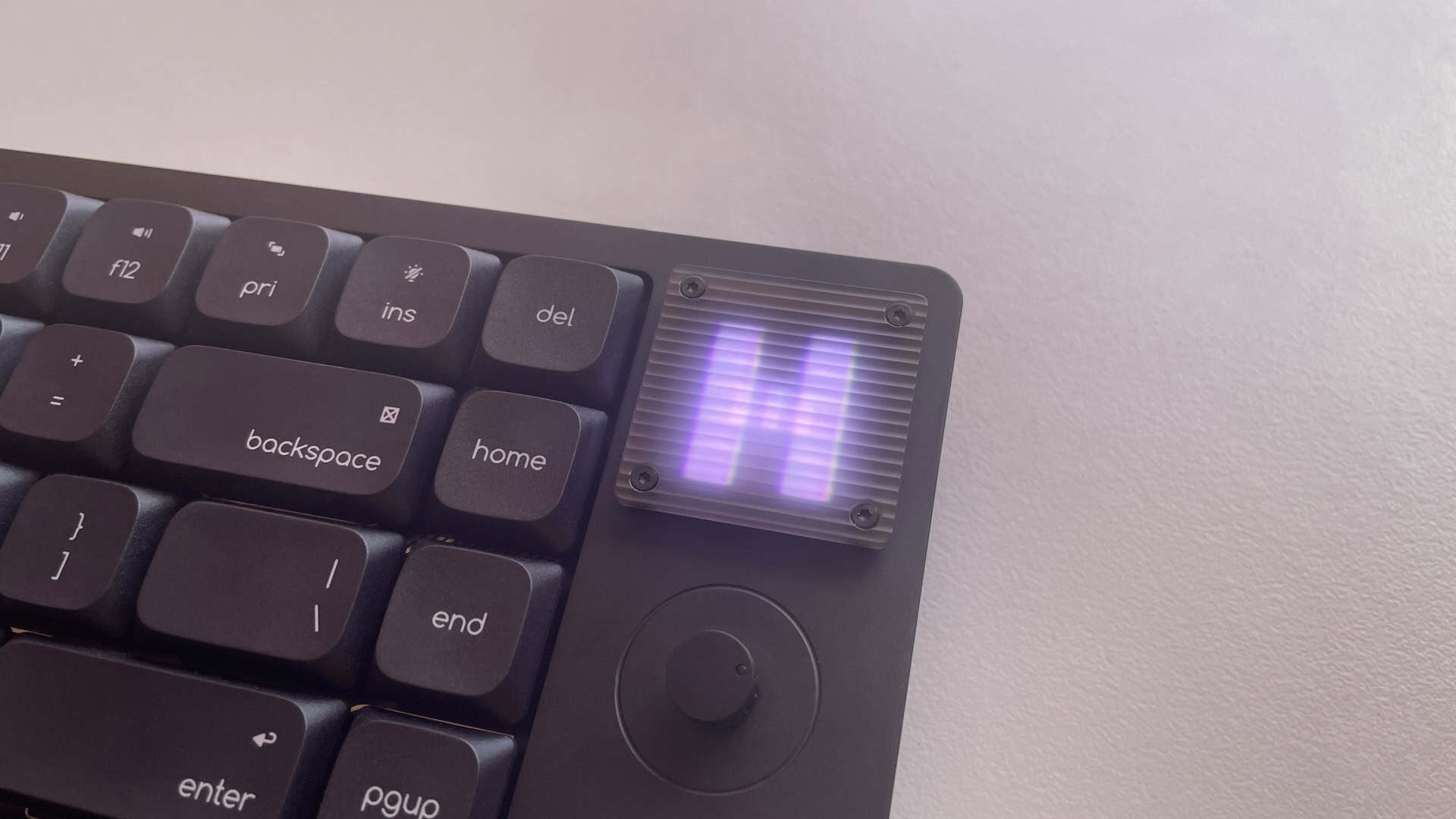 The ATK Yogo 75 Pro's retro-inspired pixel display showing a reactive animation that updates in real time to display the last key pressed.