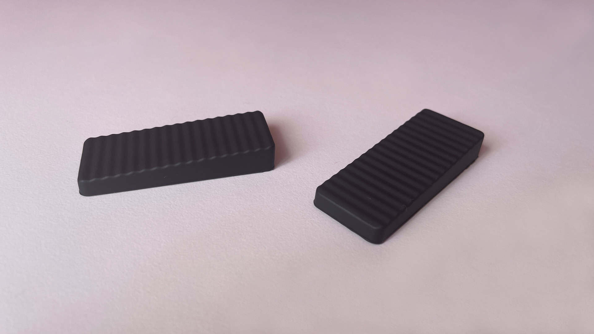 The underside of the magnetic feet for the ATK Yogo 75 Pro, showing the surface that rests on the desk when attached to the keyboard.