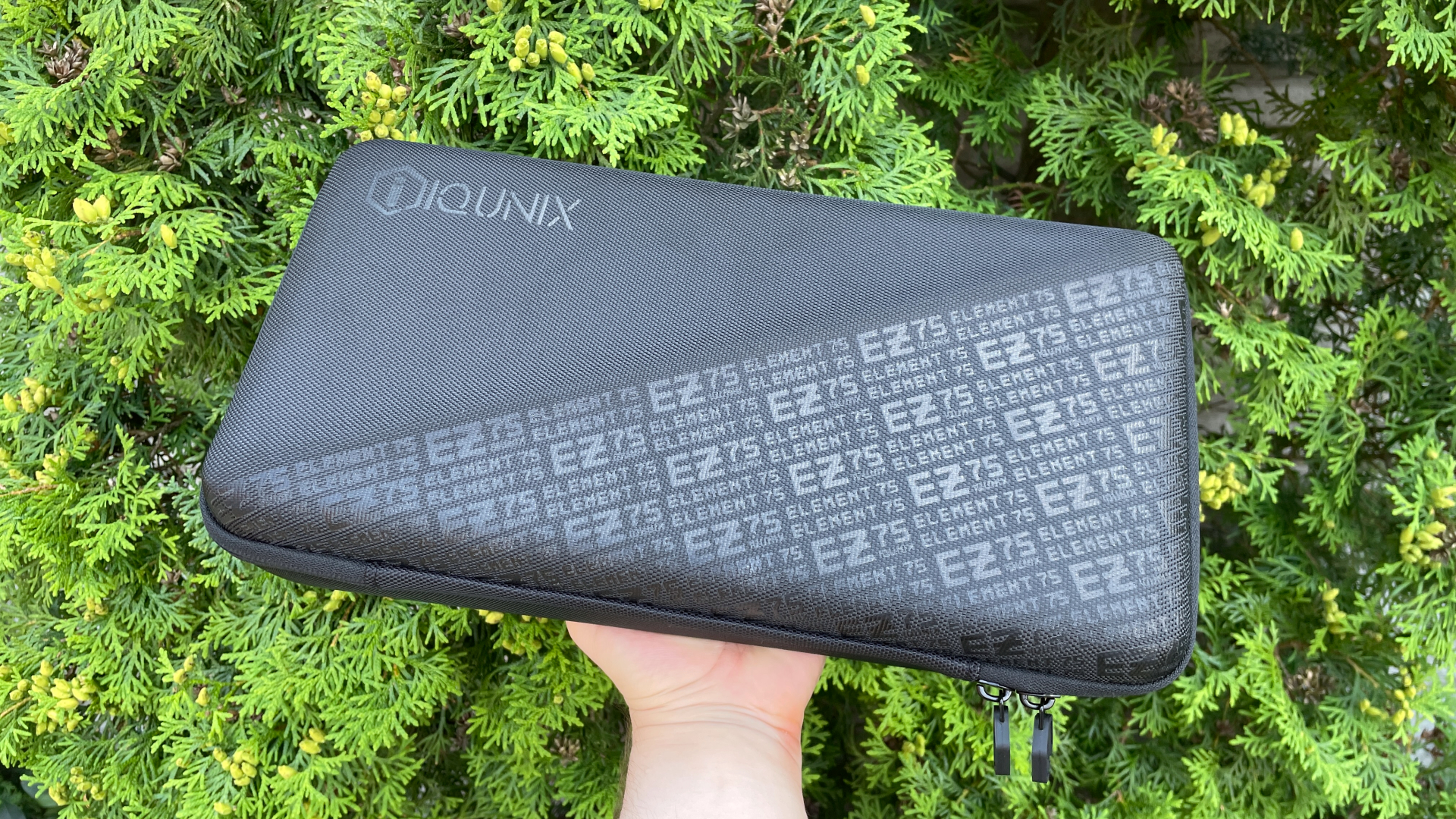IQUNIX EZ75 Review – Gaming Performance Without Compromise 3 Customized hard-shell carrying case for the IQUNIX EZ75 mechanical keyboard featuring a large EZ75 graphic on the front.