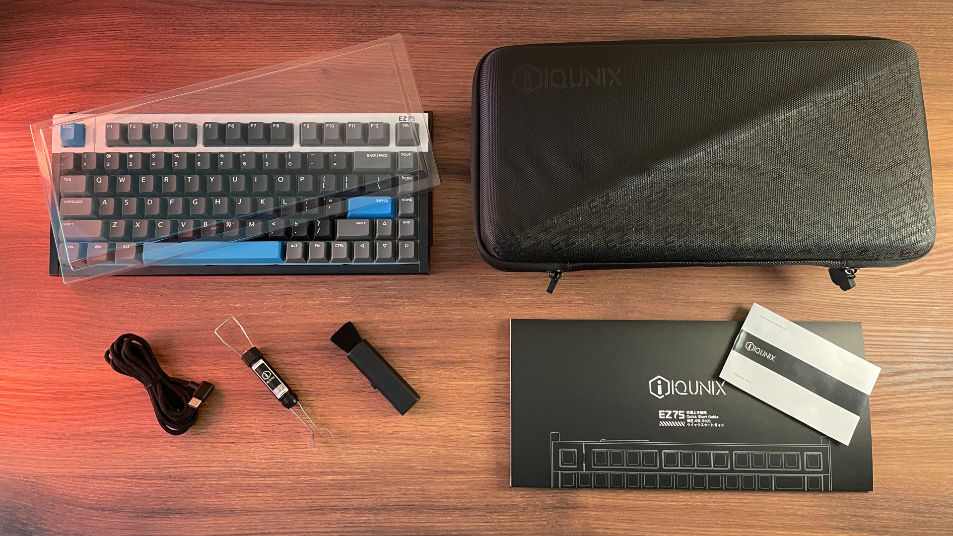 IQUNIX EZ75 Review – Gaming Performance Without Compromise 6 Complete IQUNIX EZ75 package contents laid out, including the keyboard, carrying case, USB cable, accessories, and documentation.