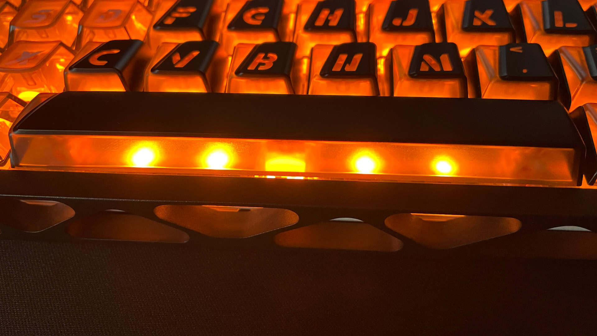 Close-up view of the additional RGB LEDs positioned beneath the spacebar on the XVX Trooper63 HE.