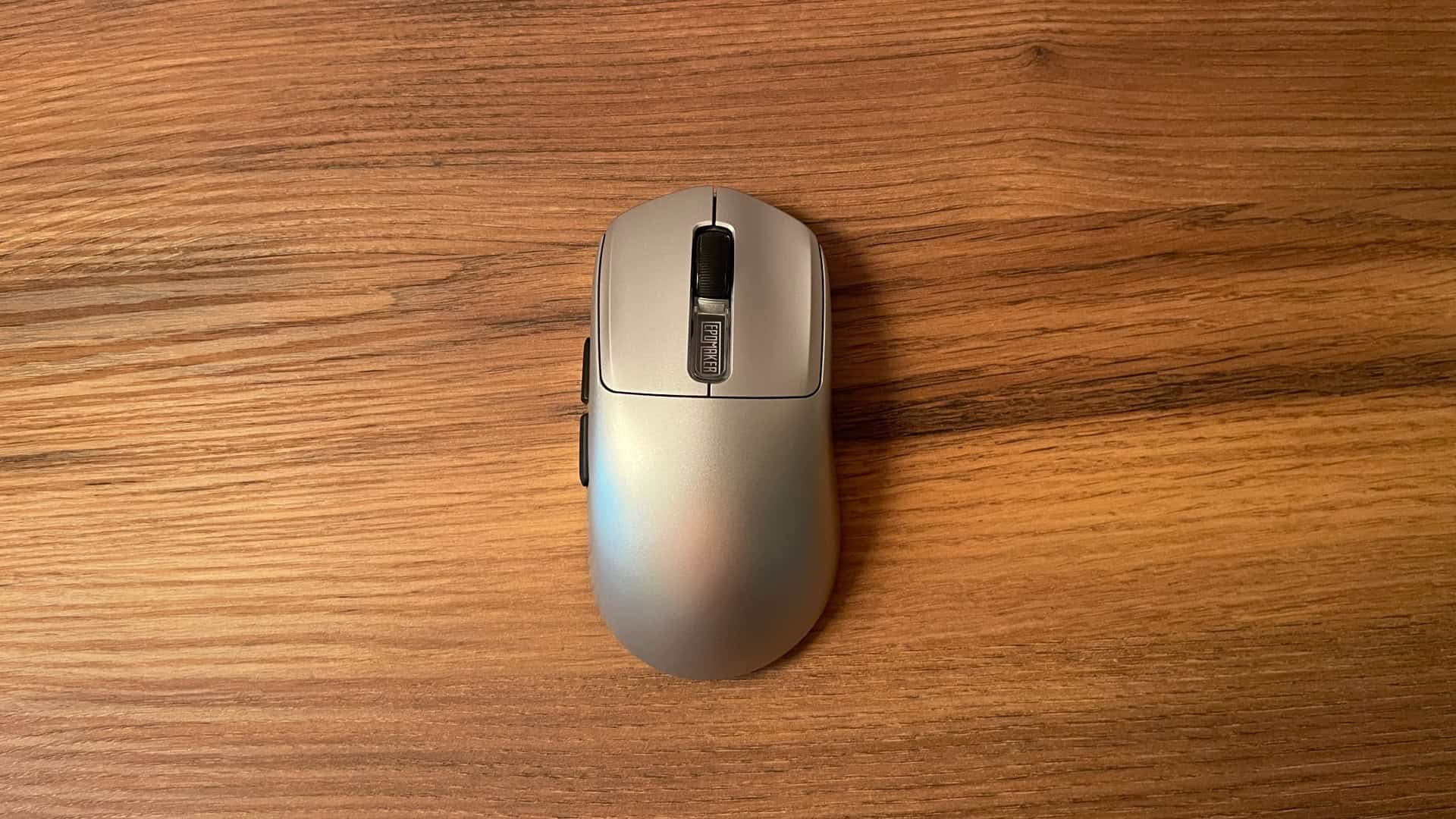 Top-down view of the Epomaker Nex Pro, showcasing its overall shape, button layout, scroll wheel, and clean, understated design.