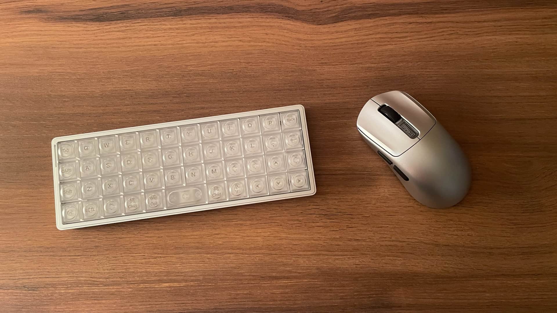 The Epomaker Nex Pro placed next to the Epomaker Luma 40 keyboard, showing how the matching silver finishes create a cohesive desktop setup.