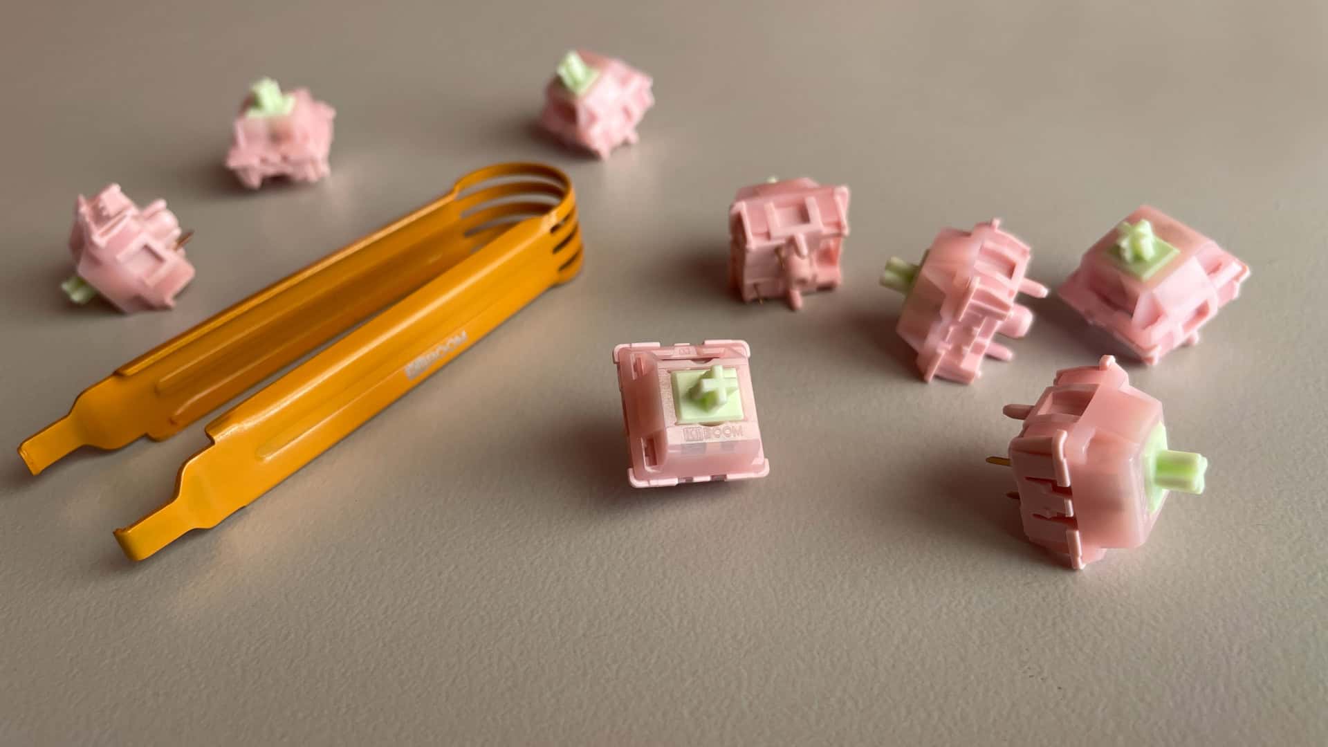 KiiBoom x Strawberryjam1986 Strawberry Jello switches scattered on a desk.