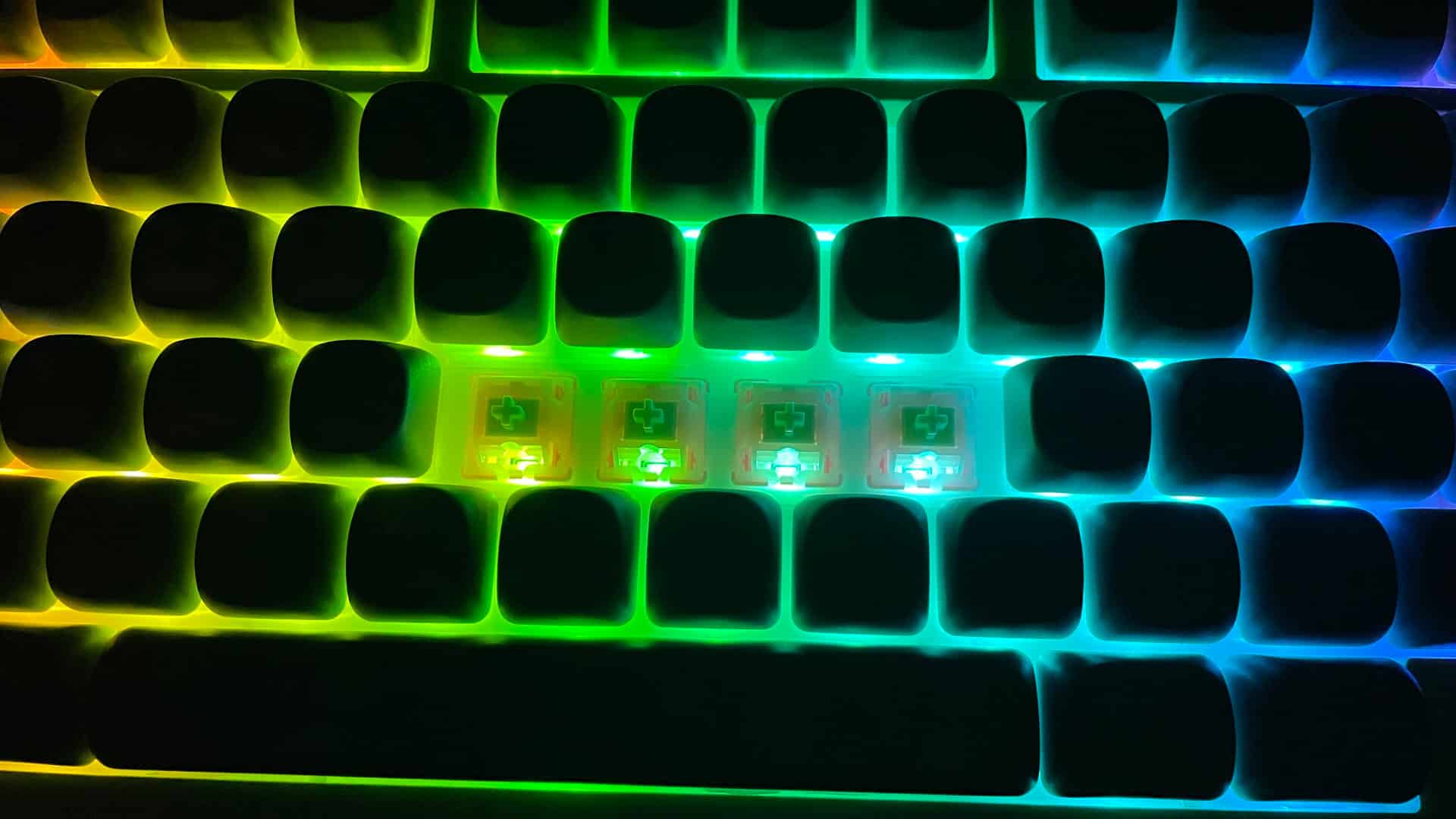 KiiBoom x Strawberryjam1986 Strawberry Jello switches installed in a mechanical keyboard, showing how the RGB backlight shines through the translucent switch housings.