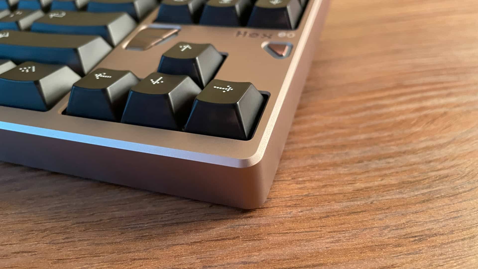 Light reflecting off the beveled edges of the ATK x QwertyKeys Hex80 aluminum case.