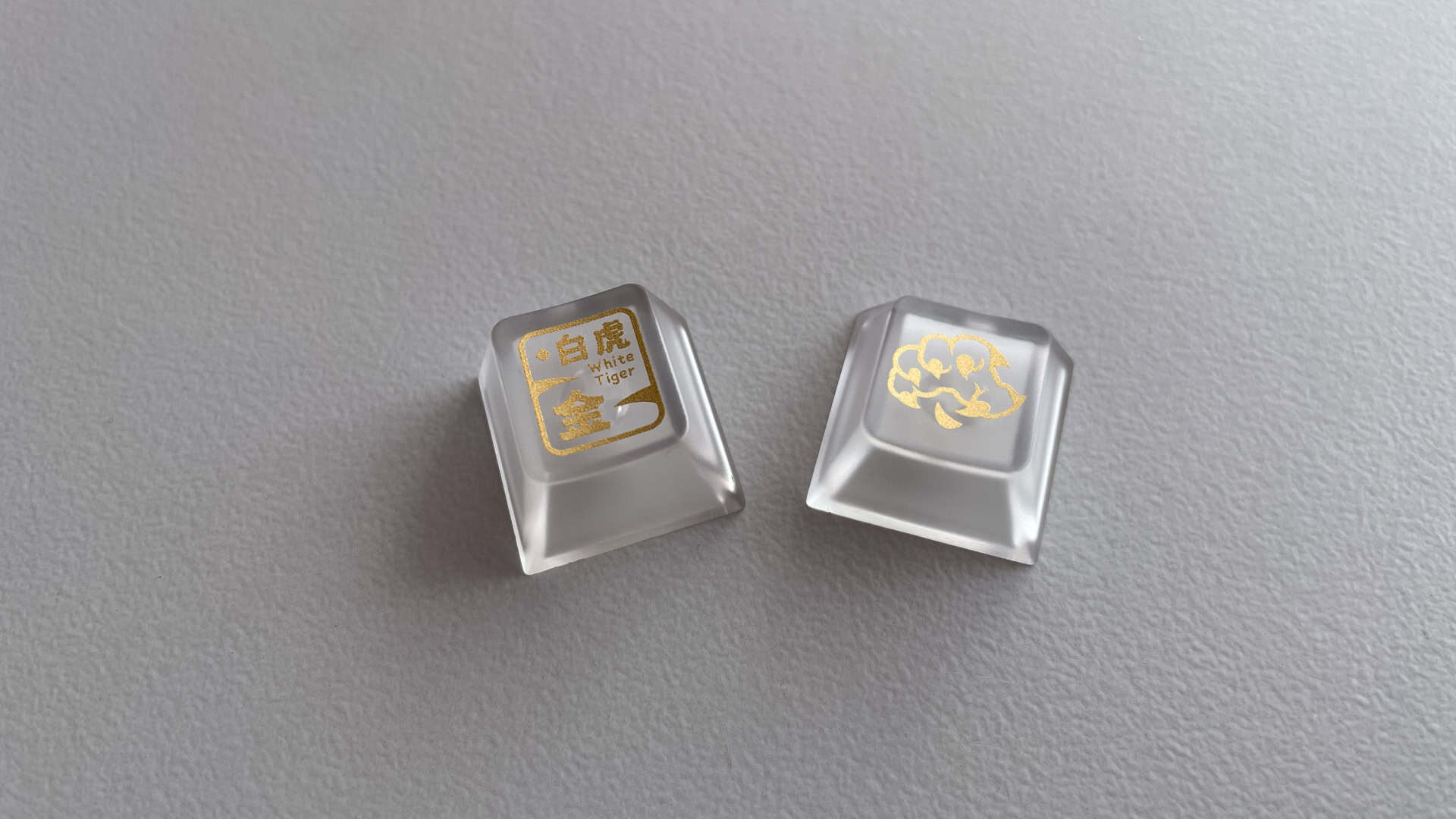 Close-up of XVX Holy Beasts Series White Tiger keycap surface showing UV-printed legends and graphics.