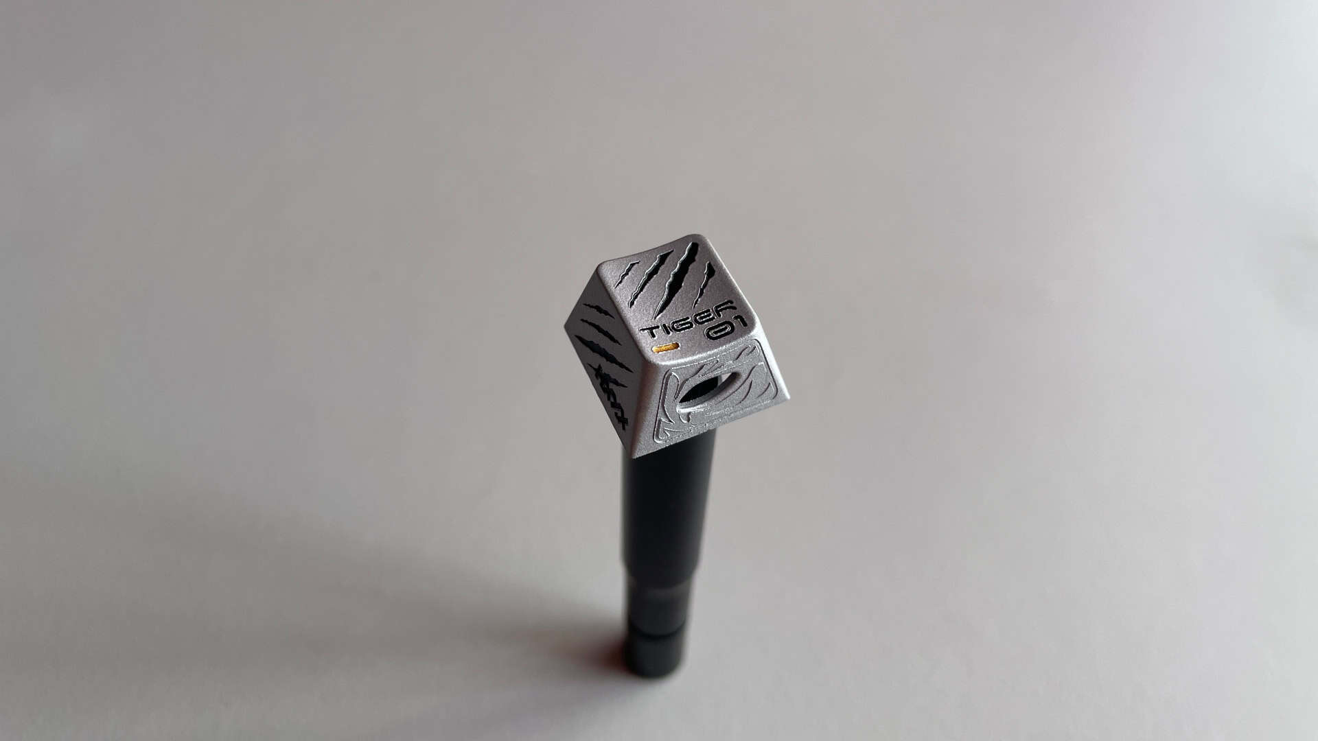 Close-up of the aluminum Esc key from the XVX White Tiger artisan keycap set.
