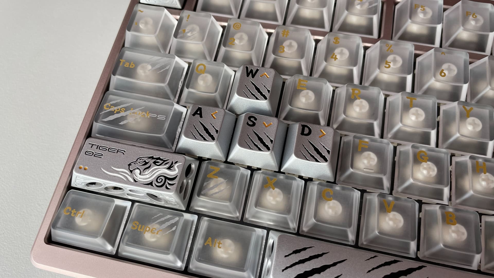 Multiple aluminum artisan keycaps installed on an ATK × QK Hex80 mechanical keyboard.
